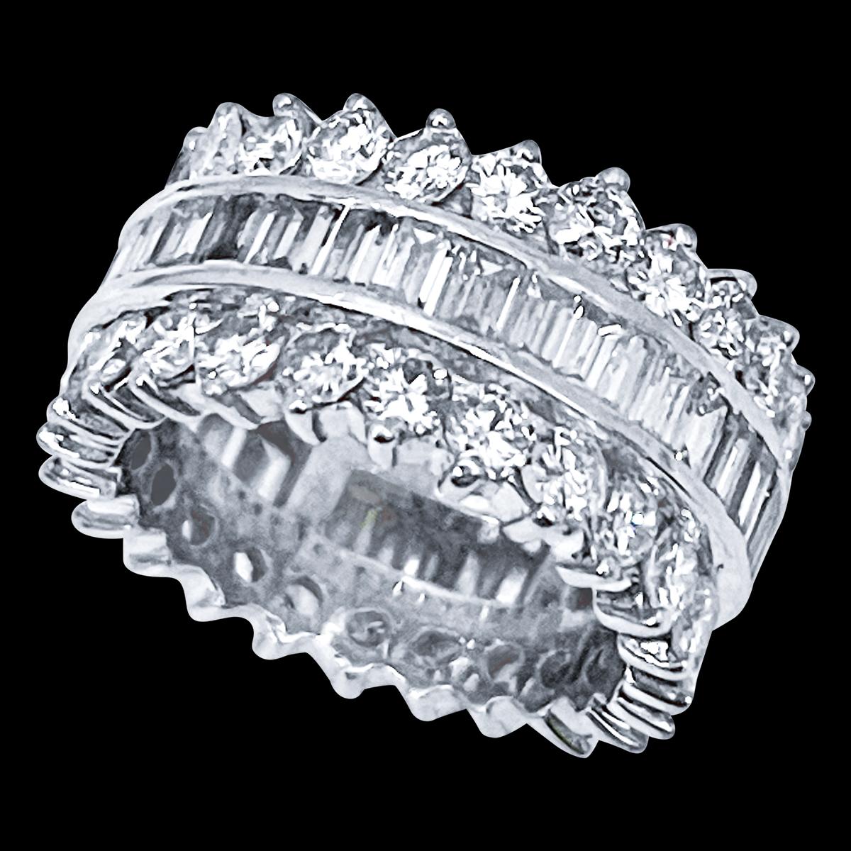 beautiful estate piece
platinum band three row band 
center row has baguettes and each side of the center row is round diamond band.
Size 6
Very clean and shiny diamonds.
This full eternity band features Three rows of round brilliant cut diamonds .