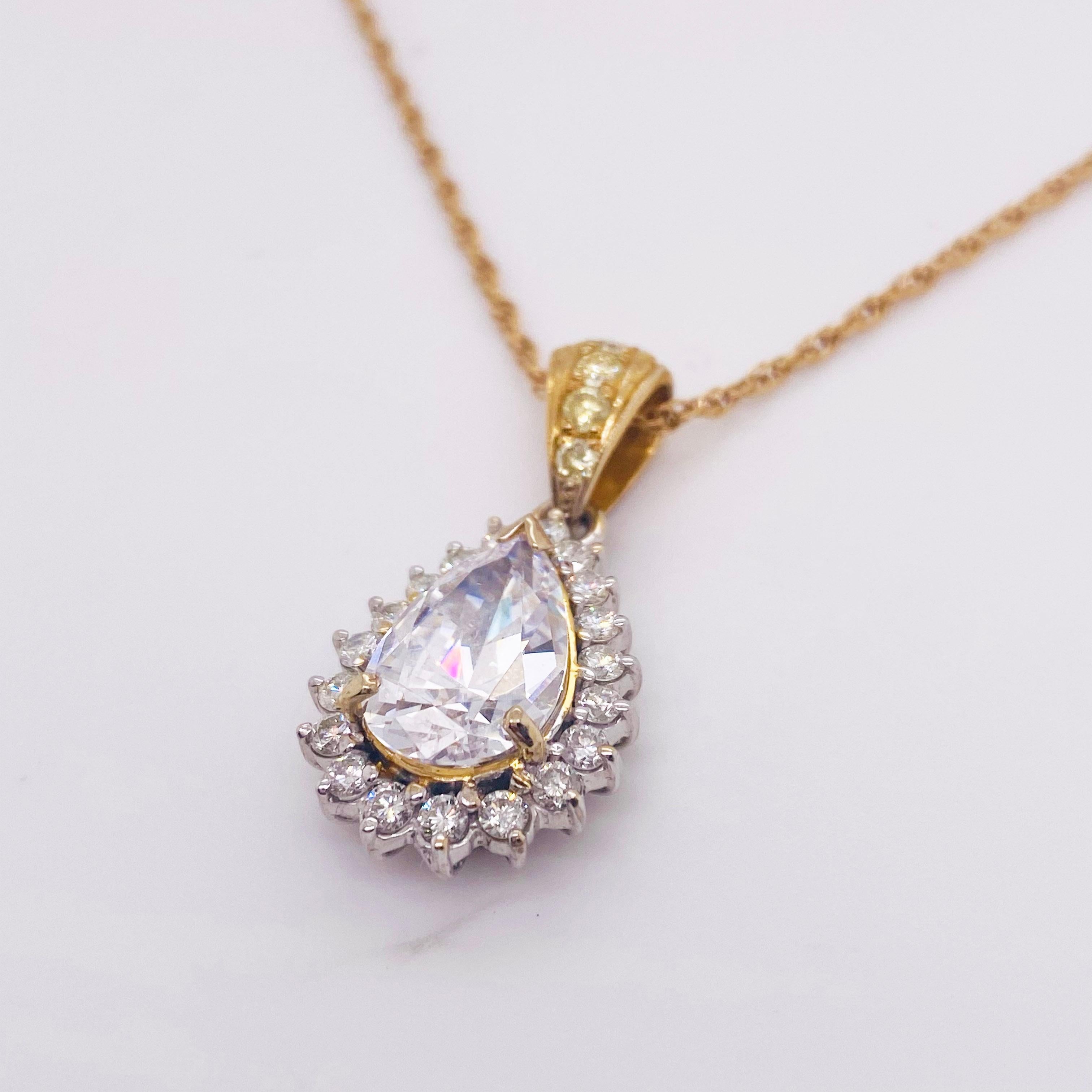 This STUNNING diamond pendant has a gorgeous diamond halo setting. It is delicately hanging from an 18K yellow gold rope chain that complements the gold in the pendant. This piece will bring a fine elegance to any look. The diamonds around the halo