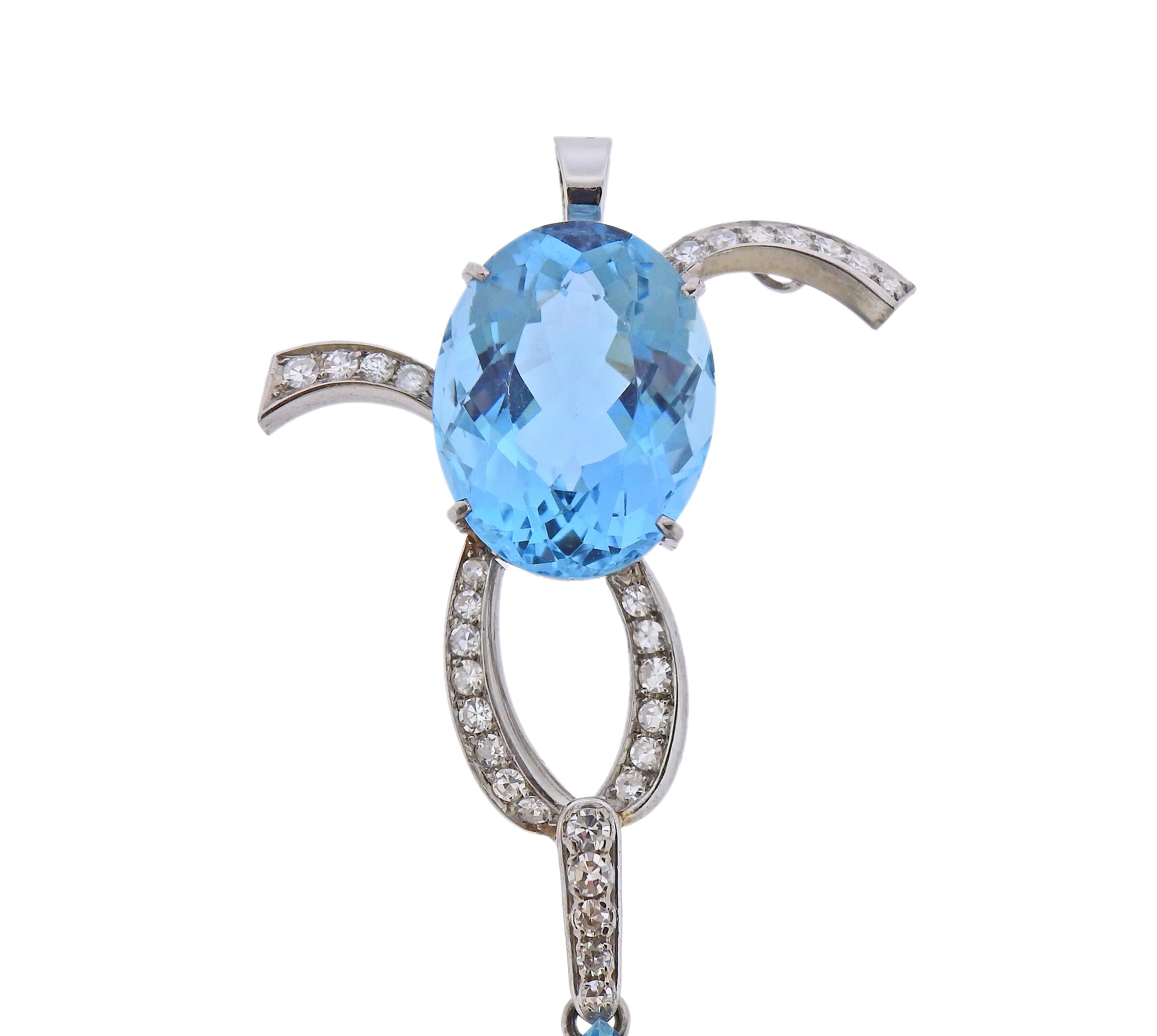 18k white gold pendant drop, set with two aquamarines. Pear shaped stone is approx. 24 carats ( 28 x 16.9 x 10.2mm) , oval stone is approx. 18 carats  (20.2 x 15.8 x 10.3mm) . Diamonds approx. 1 carat in diamonds. Pendant is 77mm long x 39mm wide.