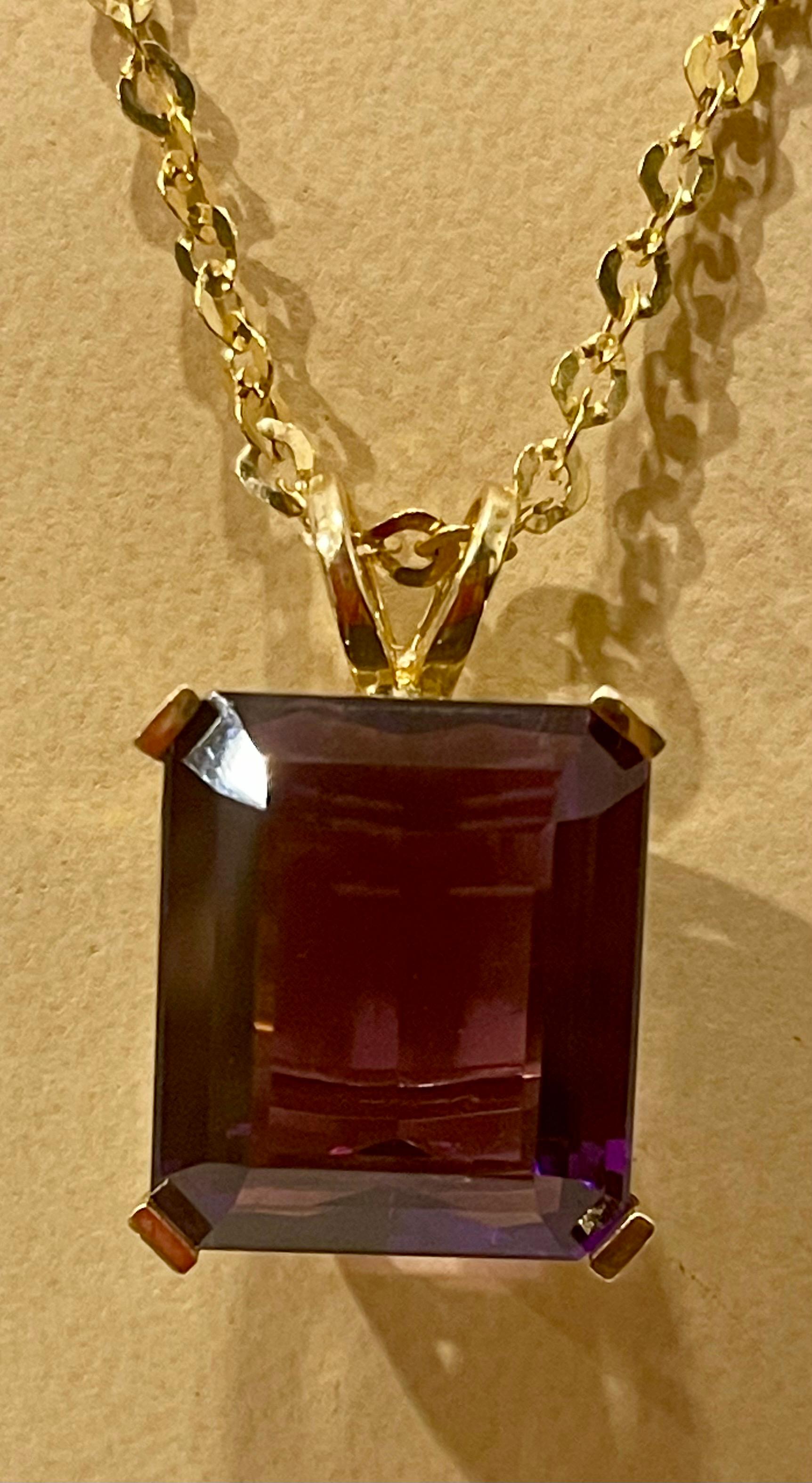  Approximately 42 Ct Emerald Cut Amethyst Pendant /Necklace + 14 Kt Yellow Gold Chain Vintage
Chain is made in Turkey and there is stamp of turkey and 14 K
This spectacular Pendant Necklace  consisting of a single large Emerald  Cut Amethyst ,
