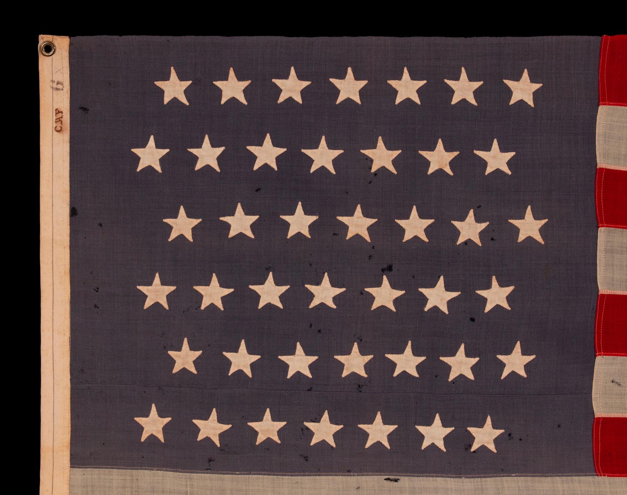 42 Hand-sewn Stars on an Antique American Flag with a Dusty Blue Canton; An Unofficial Star Count, Reflects Washington Statehood, Circa 1889-1890:

42 star American national flag, with hand-sewn stars and attractive coloration. The 42 star flag is