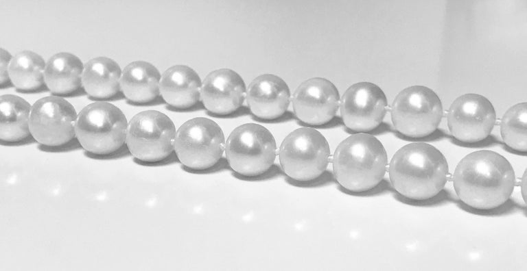 42 inch Strand of Cultured Fresh Water Pearl Necklace comprising 89 well matched slightly off round cultured pearls gauging approximately 10.00 - 11.50 mm, white, medium - high lustre, medium - thick nacre, very slightly blemished, with 14K and