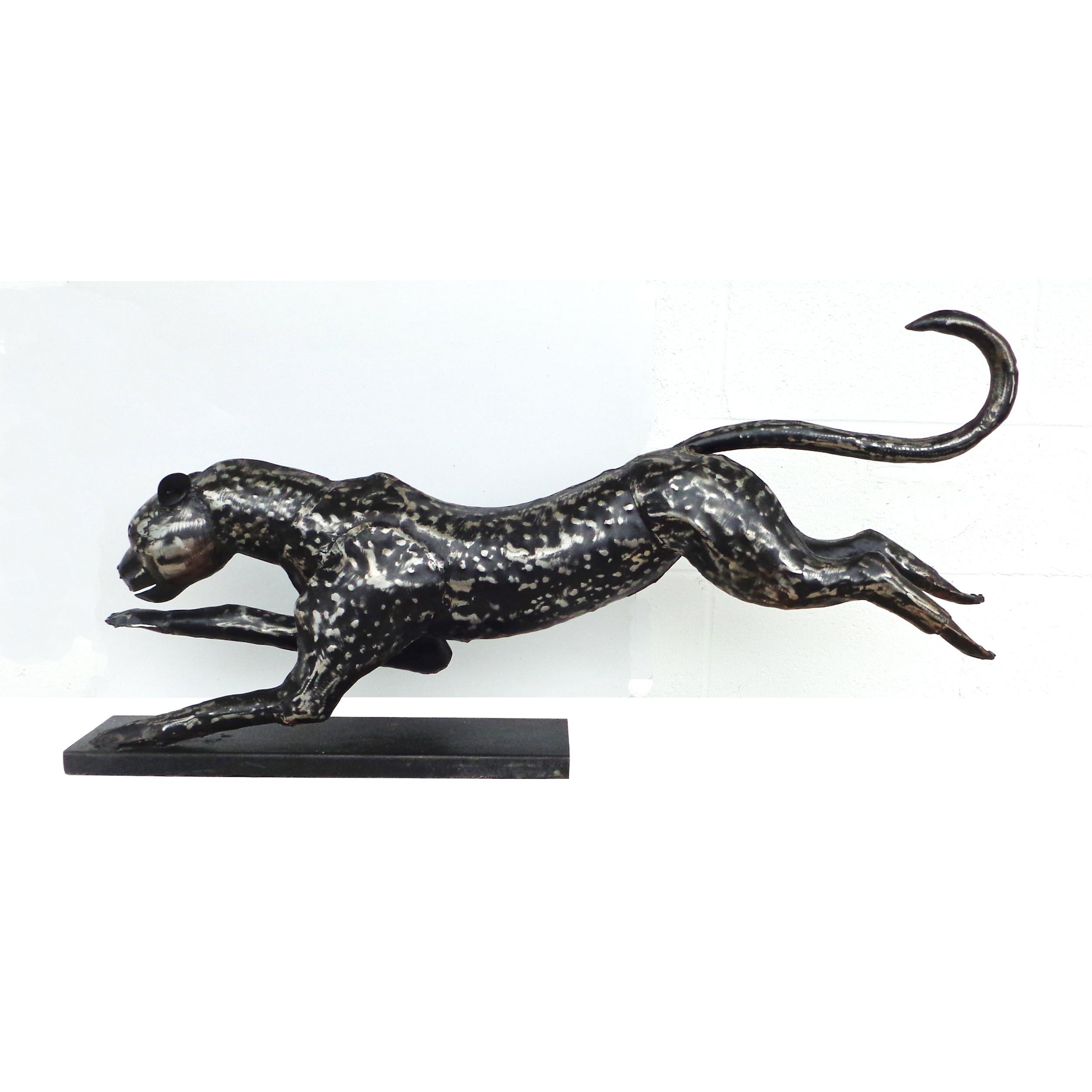 42″ Metal Cheetah

In motion resting on base.
Forged metal with ebony accents.

42″ W  x 7.5″ D x 20″ H
