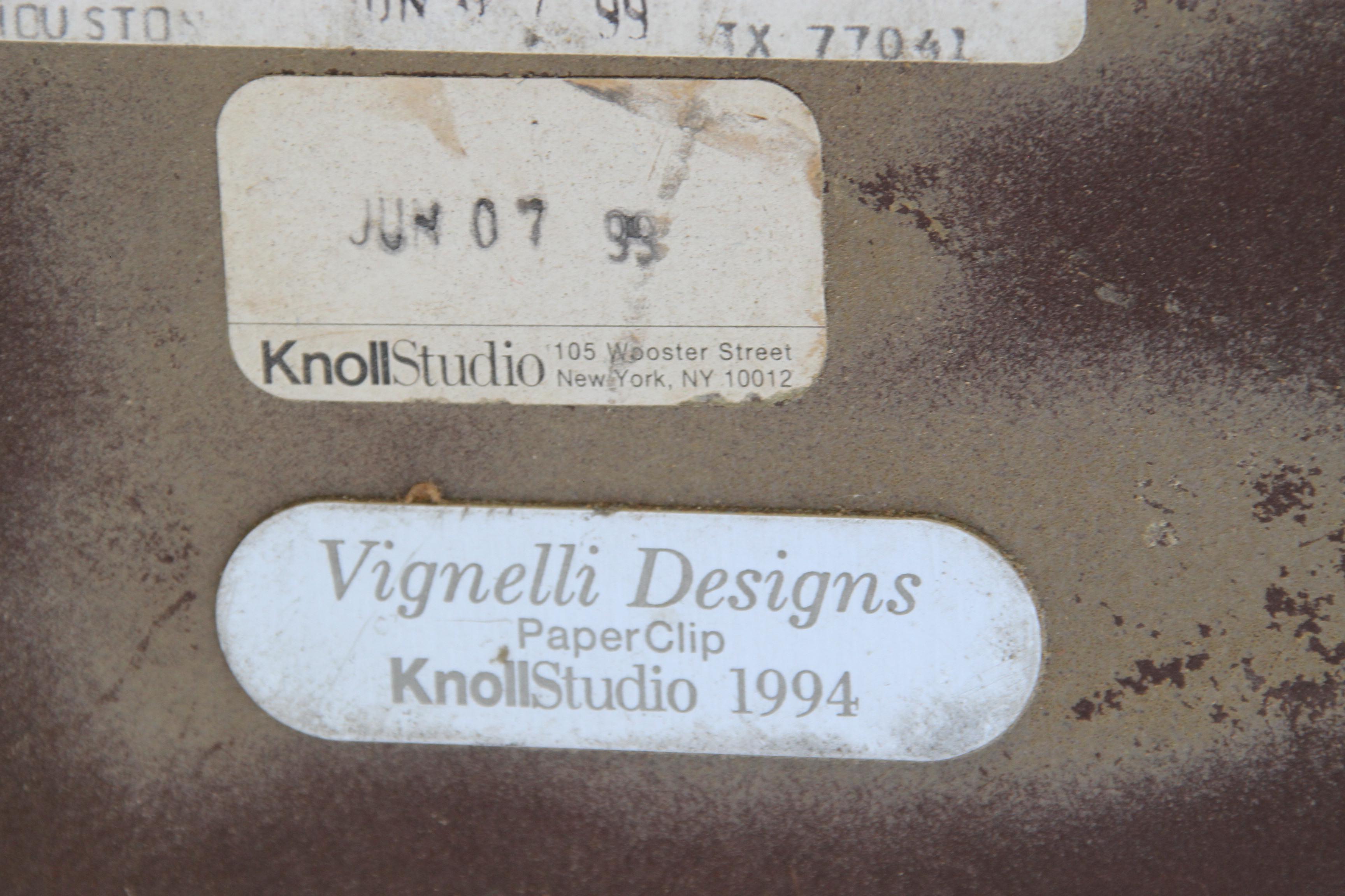 Vignelli Paperclip Dining Table
1999

Designed by Lella and Massimo Vignelli in 1994 and produced by Knoll, this dining table is from their iconic PaperClip series. Features a round bevel-edged laminate top on a bent-wire base of ebonized