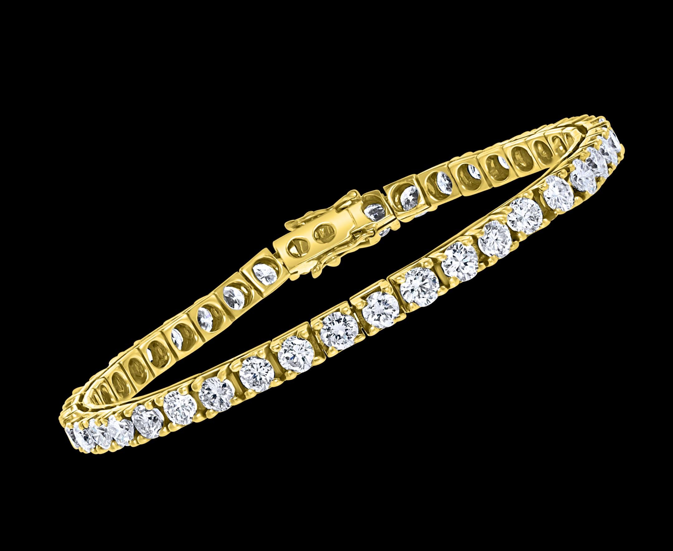 
42 Round Diamond 25 Pointer Each  Line Tennis Bracelet  14 K Yellow Gold 10 Ct 
Meet the ultimate bold tennis bracelet. The single row of prong set Round Brilliant cut Diamonds.
25 pointer each , 42 Total pieces approximately 10 Ct
Very Fine