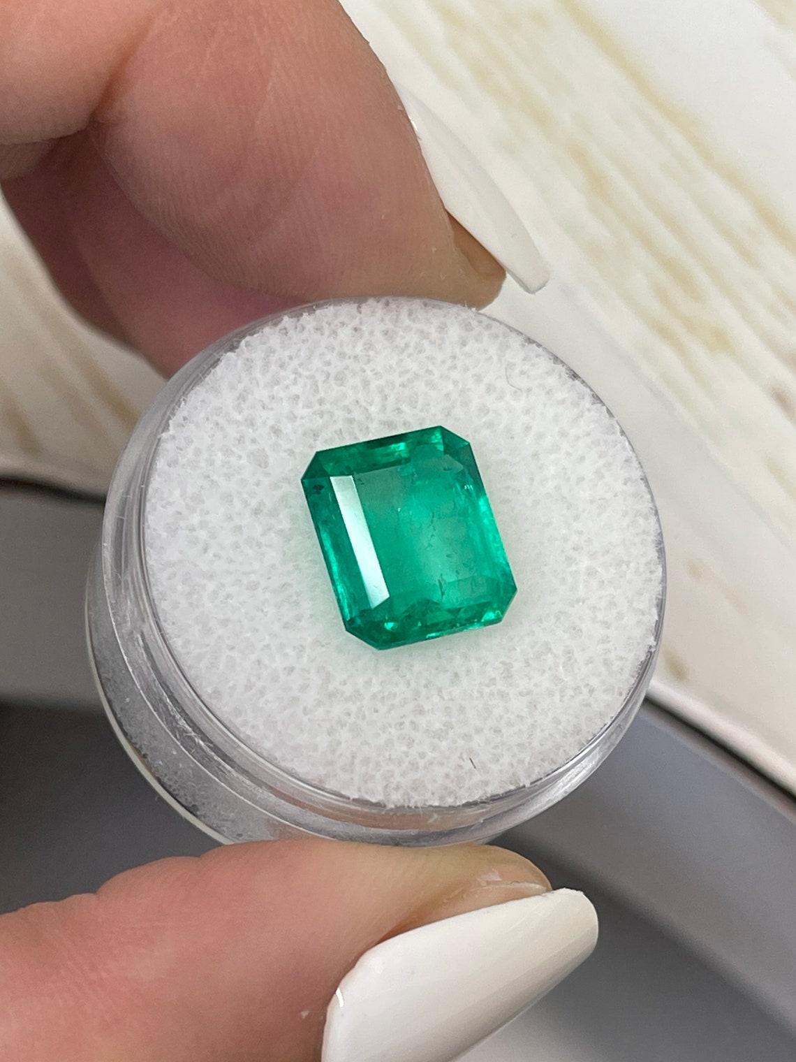 Stone: Emerald
Weight: 4.20-carats
Shape: Emerald Cut
Clarity: Transparent
Luster: Very Good
Color: Vivid Green
Measurements: 10.85mm x 9.34mm x 5.39mm
Geographic Origin: Colombia
Treatment: Natural, Oiling

Comments: Due to their growth conditions
