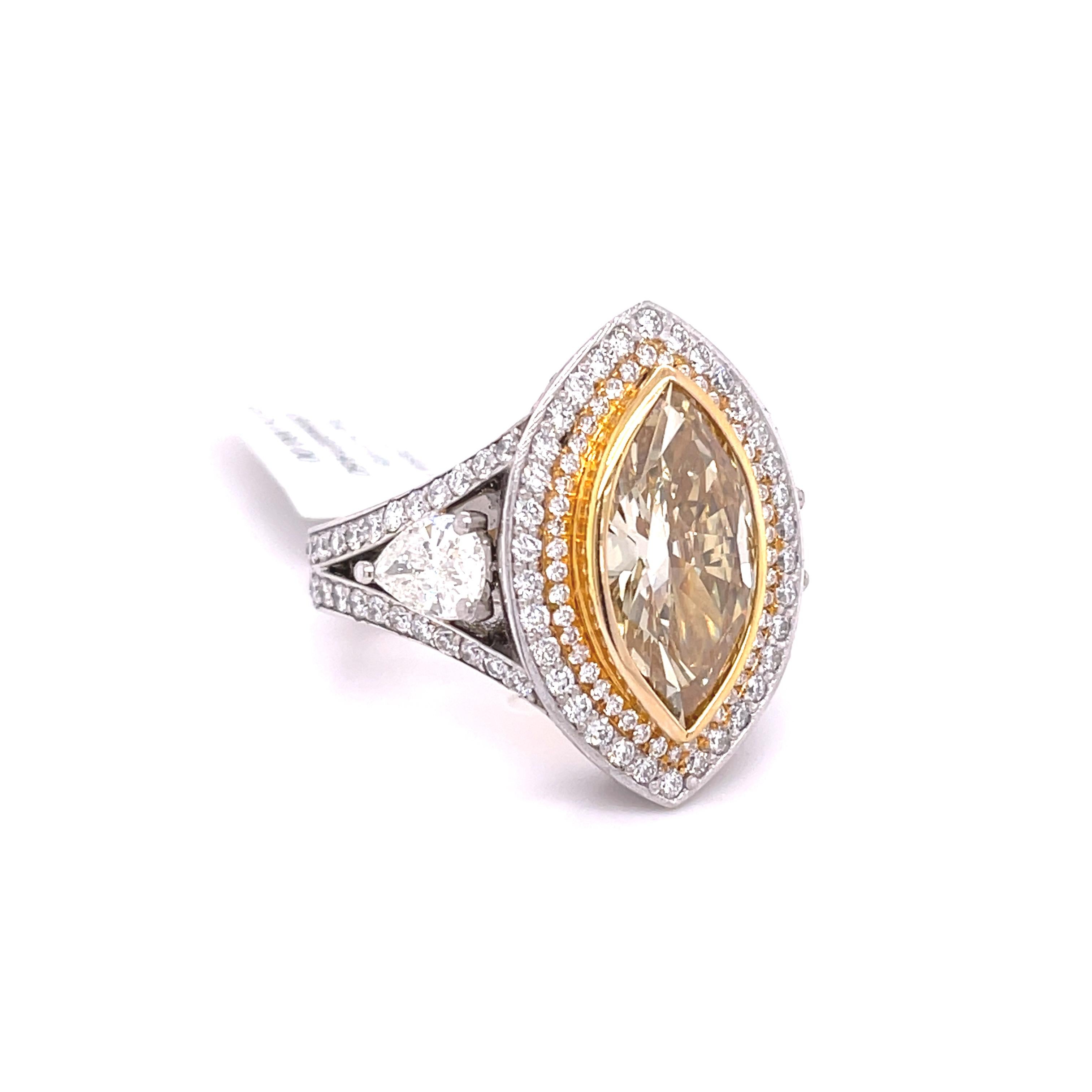 Apart of our collection of rare and unique diamonds. This ring presents a beautiful canary diamond at its center, its bezel setting allows the diamonds bright and vibrant yellow colors to be seen in its entirety. This diamond is set in platinum and