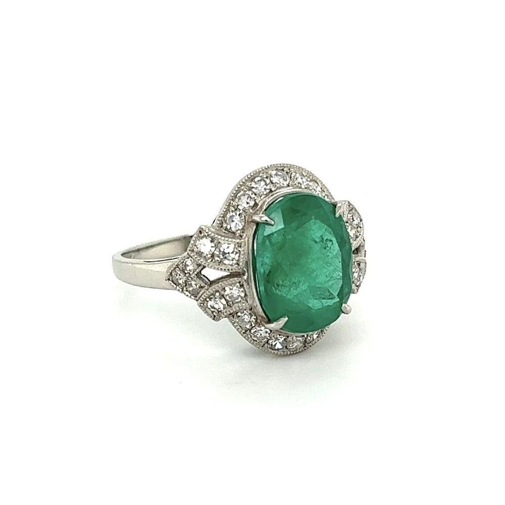 Simply Beautiful! Finely detailed Vintage Oval Columbian Emerald GIA and RBD Diamond Platinum Ring. Center Hand set with a securely nestled 4.20 Carat Oval Columbian Emerald, GIA. Surrounded by Hand set Round Brilliant Cut Diamonds, weighing approx.