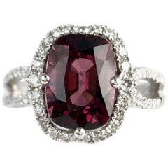 4.20 Carat Cushion Cut Garnet Ring with White Diamond Halo in 18 Karat Gold