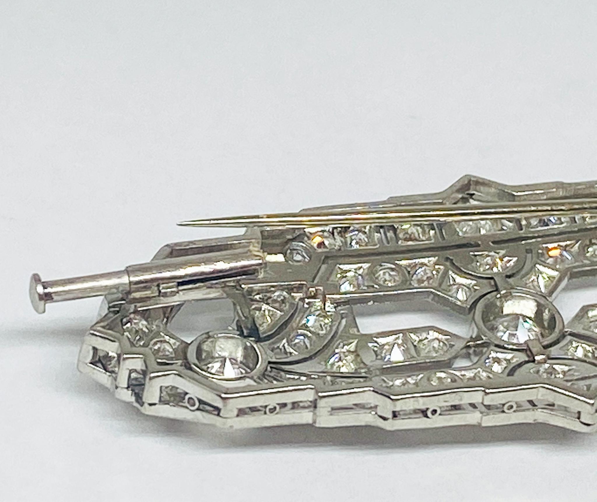 Ornately designed antique brooch from the 1920's in impeccable condition featuring a beautiful collection of round cut white diamonds weighing 4.2 carats with a I color grade and a VVS clarity grade all set in milgrain beading in a very intricate