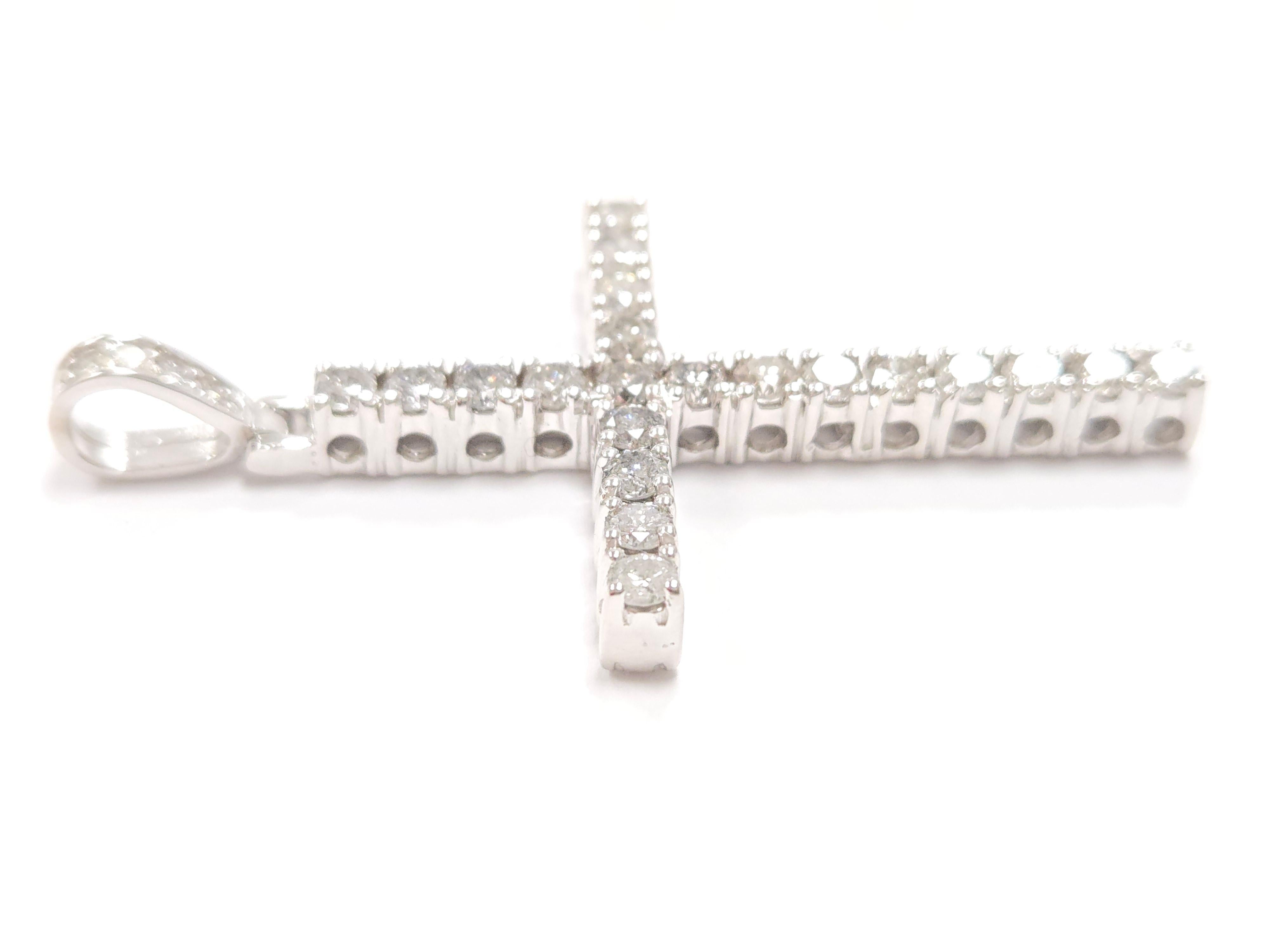 Beautiful 14 karat white gold and diamond cross pendant. A total weight of 4.20 carats round cut diamonds very sparkly and shiny look.

Average Color: G
Average Clarity: I2
26 Pieces Natural Diamonds
Measurements: 2.50 L x   W x 0.25 D inch