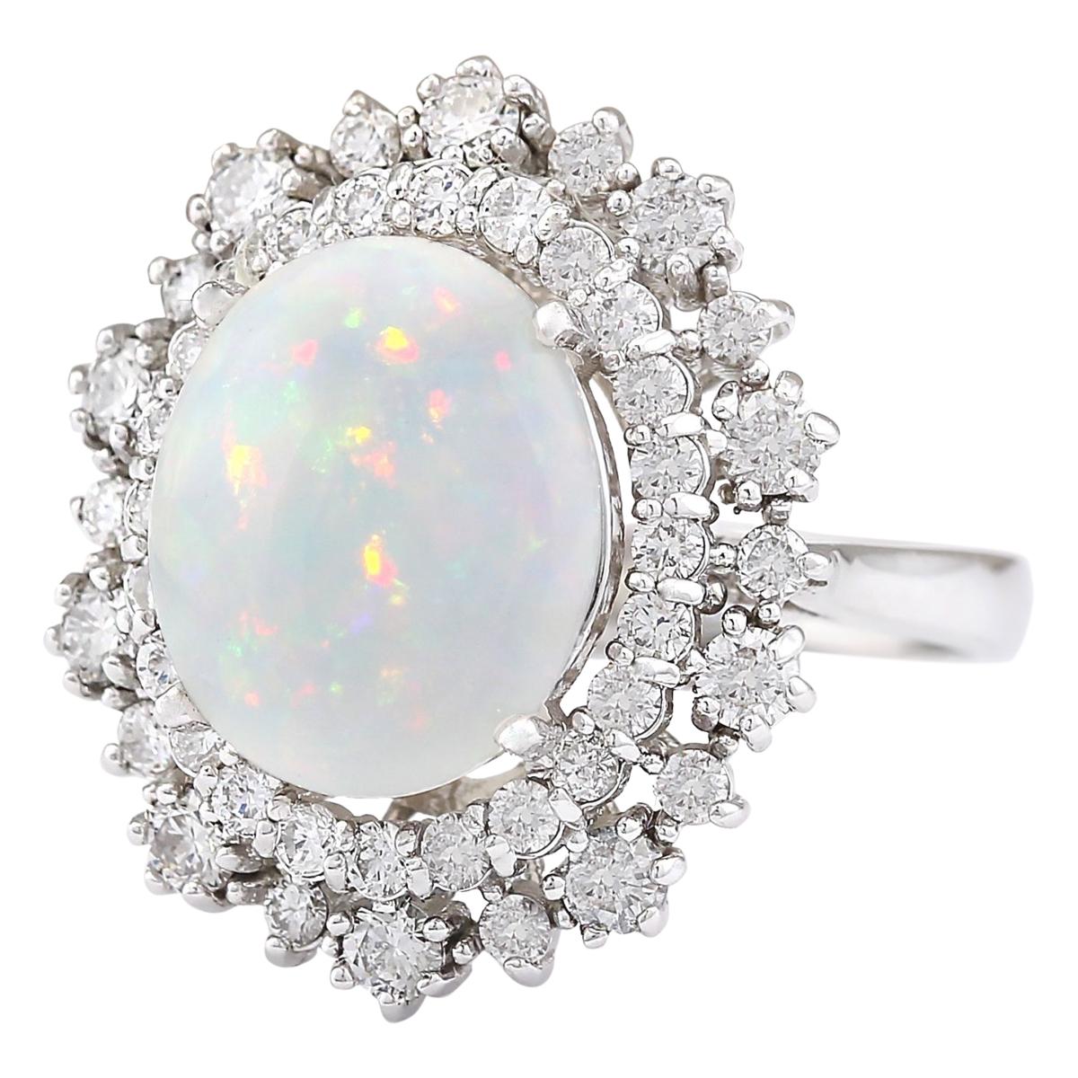 4.20 Carat Natural Opal 14 Karat White Gold Diamond Ring
Stamped: 14K White Gold
Total Ring Weight: 6.5 Grams
Total Natural Opal Weight is 3.05 Carat (Measures: 12.00x10.00 mm)
Color: Multicolor
Total Natural Diamond Weight is 1.15 Carat
Color: F-G,