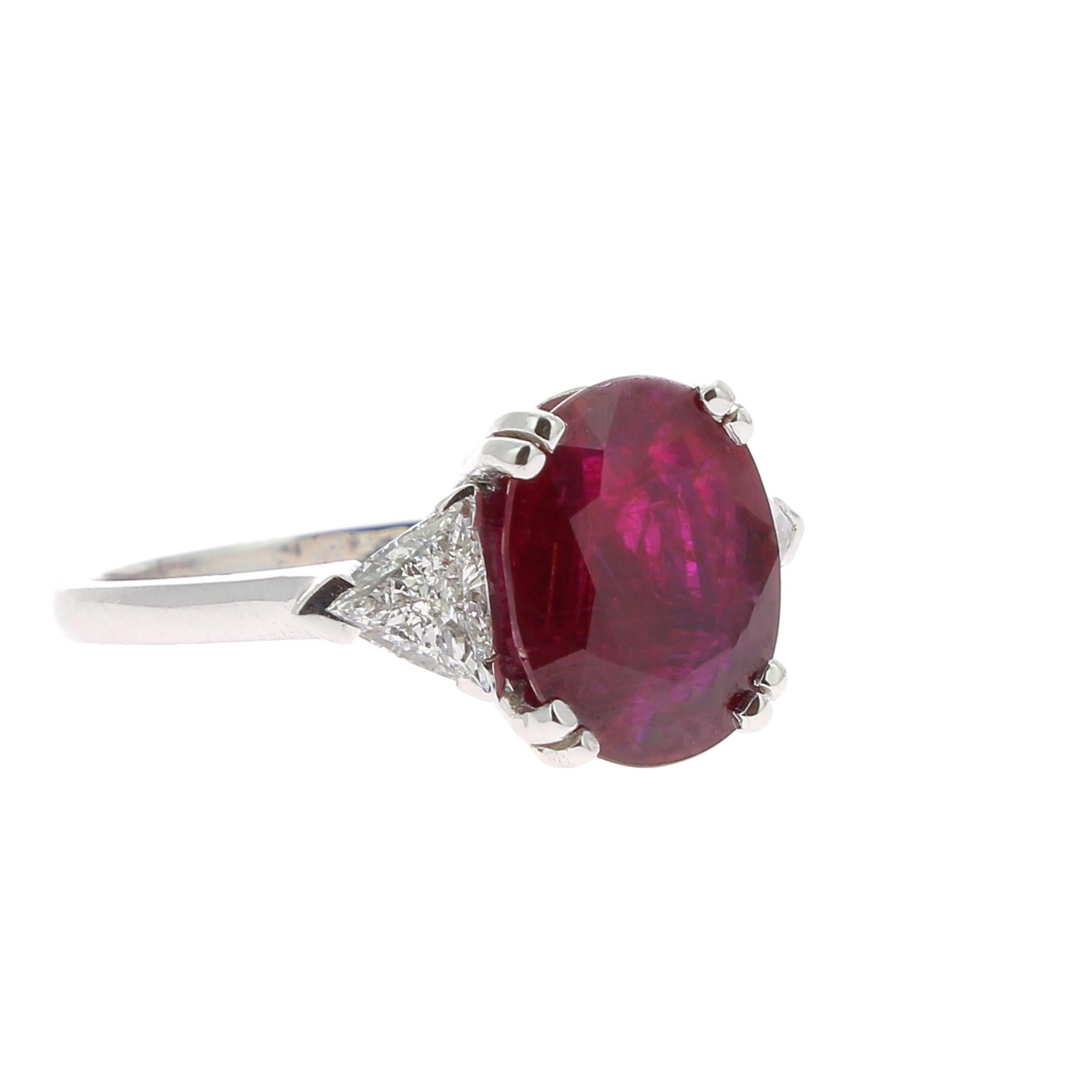 An amazing Ruby Ring set with 2 Triangle Diamond.
The total weight of the Ruby is 4.20 Carats, the gemstone is certified. 
The ring is set with 2 Triangle Diamonds weighing 0.61 Carats.
The Size of the Natural Ruby ring is 6.5 US / 53 FR / N UK / 53