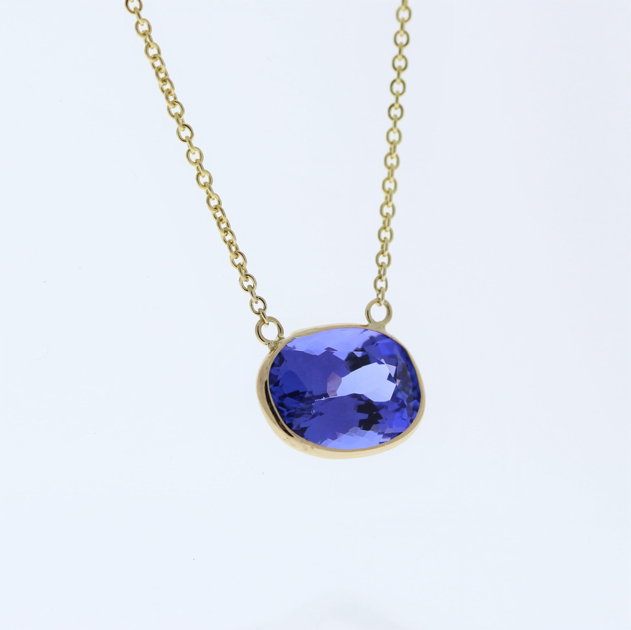 The necklace features a 4.20-carat oval-cut tanzanite set in a 14 karat yellow gold pendant or setting. The oval cut and the mesmerizing blue-violet color of the tanzanite against the yellow gold setting are likely to create a luxurious and