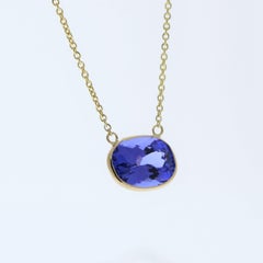 Collane di moda con tanzanite ovale blu da 4,20 carati in oro giallo 14k