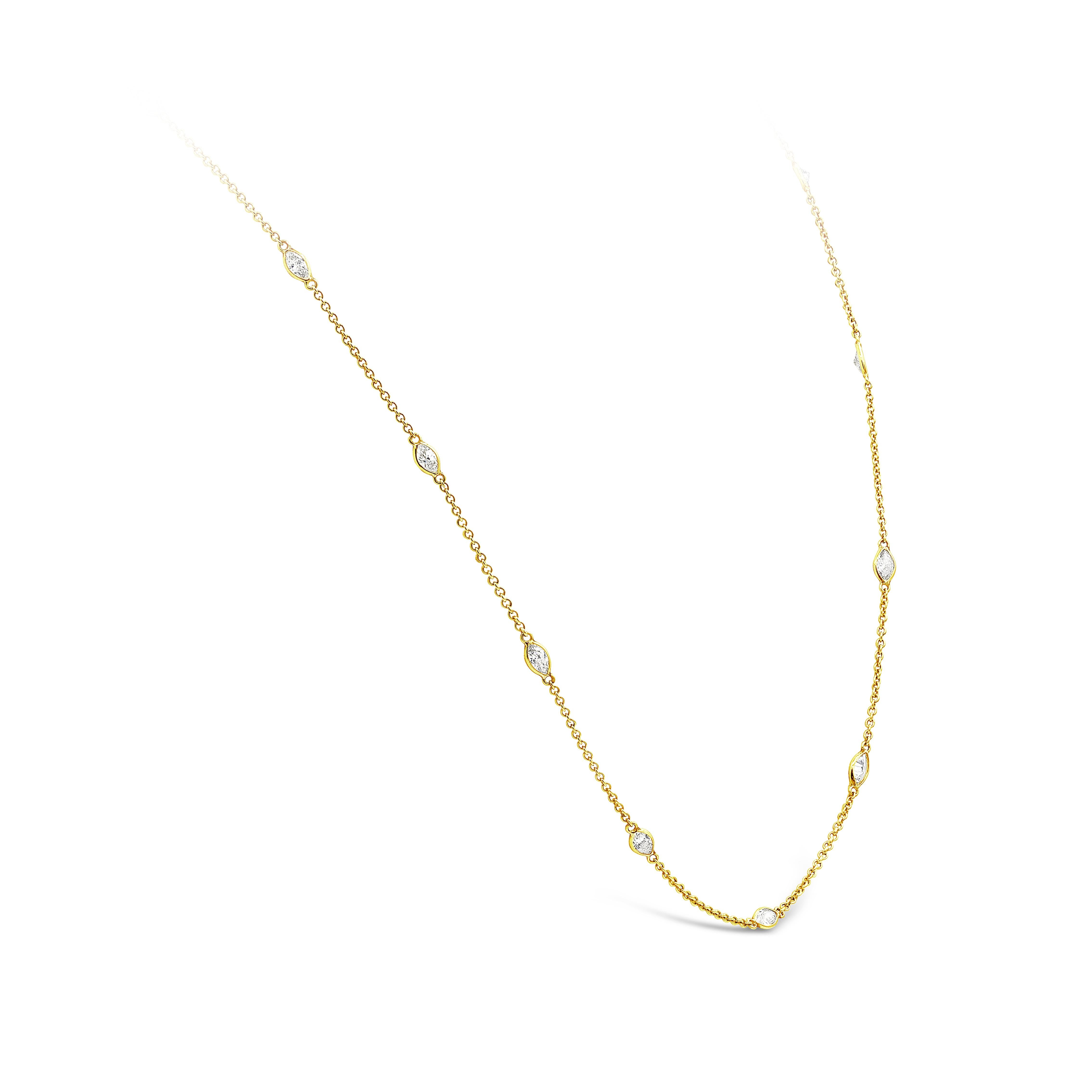 A simple yet classic necklace that packs a lot of sparkle; a line of marquis cut diamonds bezel set in 18k yellow gold are perfectly spaced for that delicate and feminine look and finish. 22 pieces of diamonds weigh 4.20 carats total. Approximately