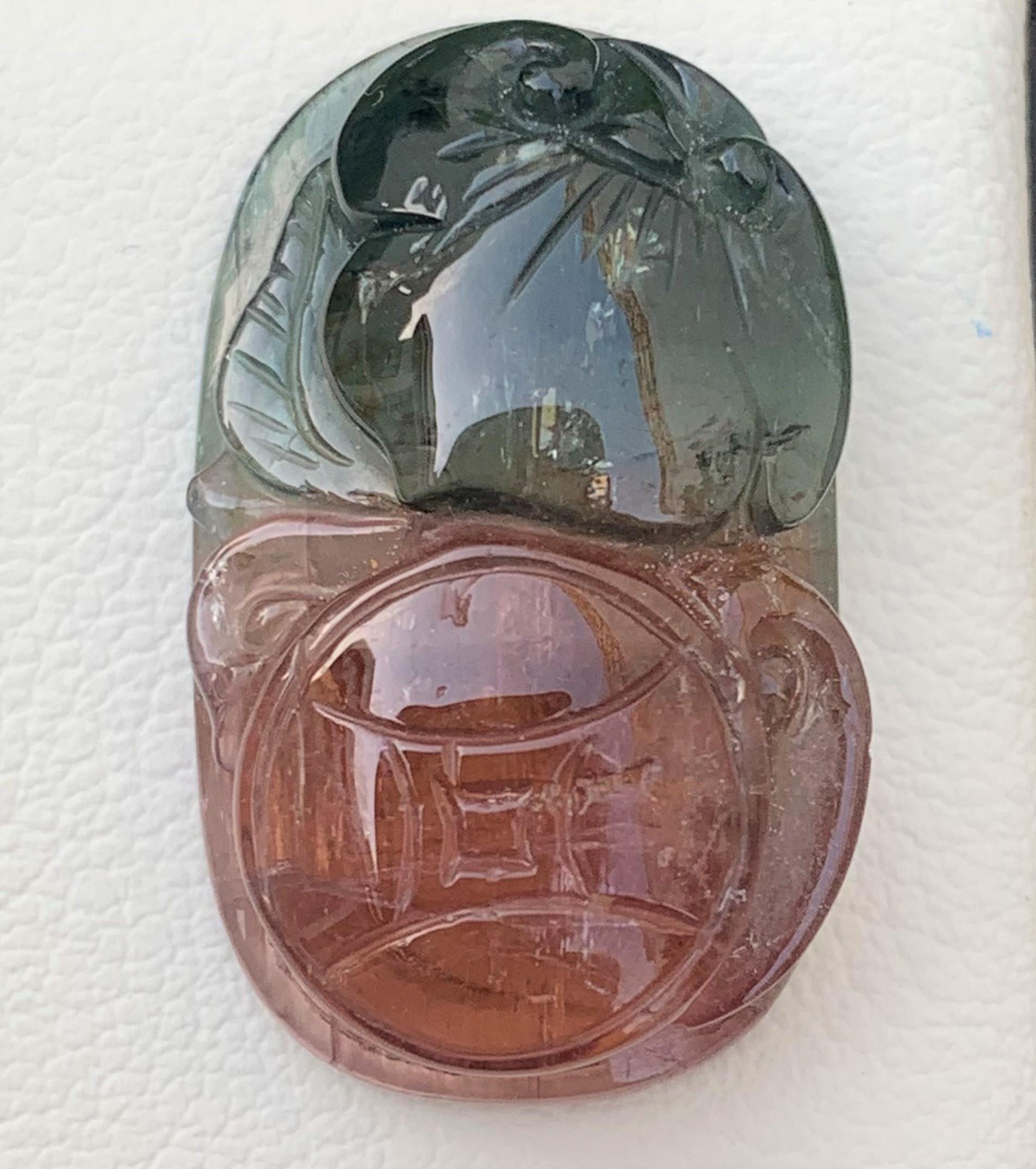 Unique Bi-Color Tourmaline Carving From Madagascar Africa 
Weight: 42.00Carats
Dimension: 2.9 x 1.7 x 0.9 Cm
Origin: Africa
Color: Peach & Green
Shape: Carving
Quality: AAA

Bicolor tourmaline is connected to the heart chakra, which makes it
