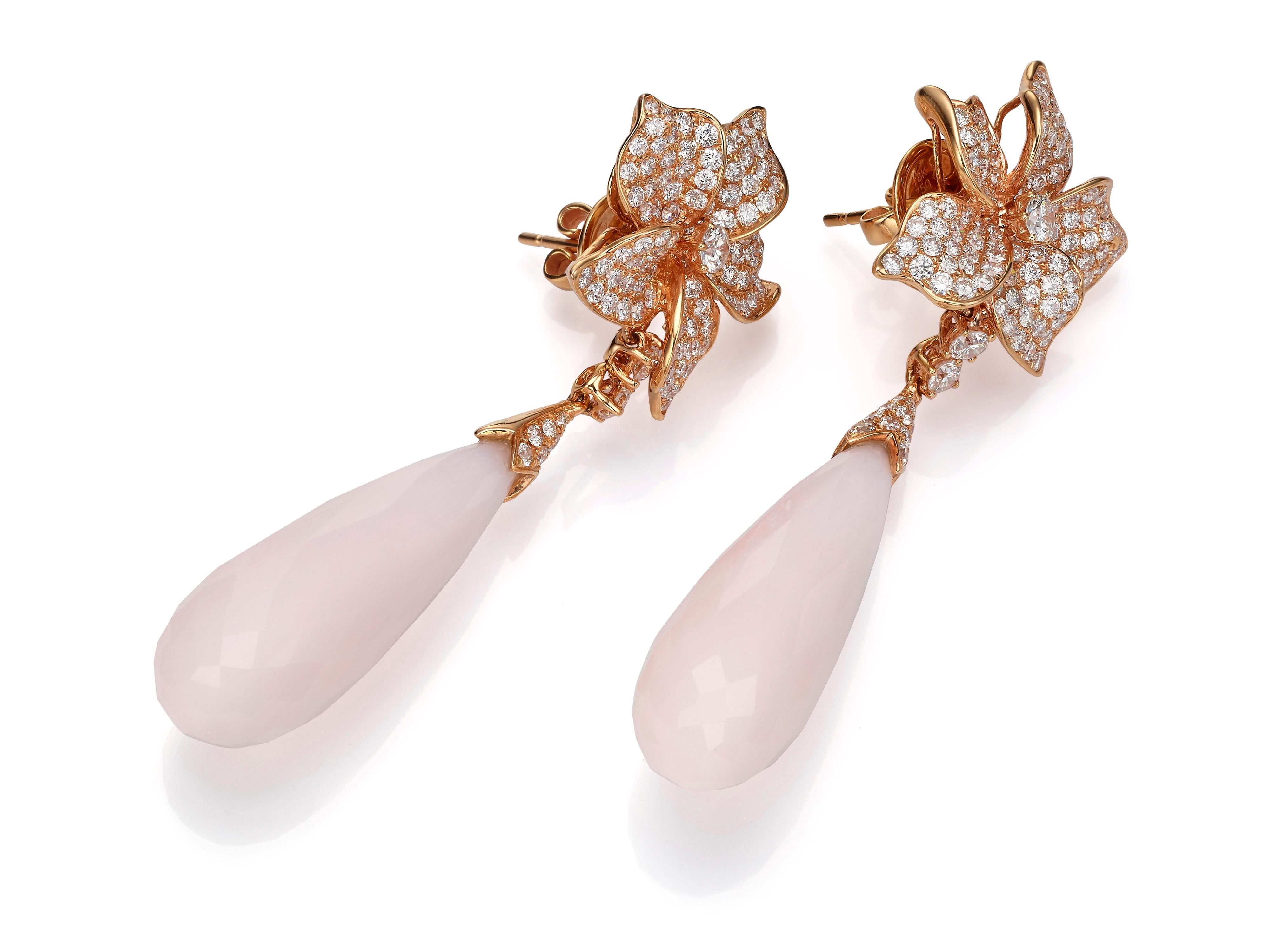 Crafted from 18K rose gold, these floral earrings are encrusted with 4.01 carats of shimmering white diamonds and tipped with two pink opals (totaling 38.05 carats) that move freely.

Composition: 
18K Rose Gold
246 Round Diamonds: 4.01 carats
2