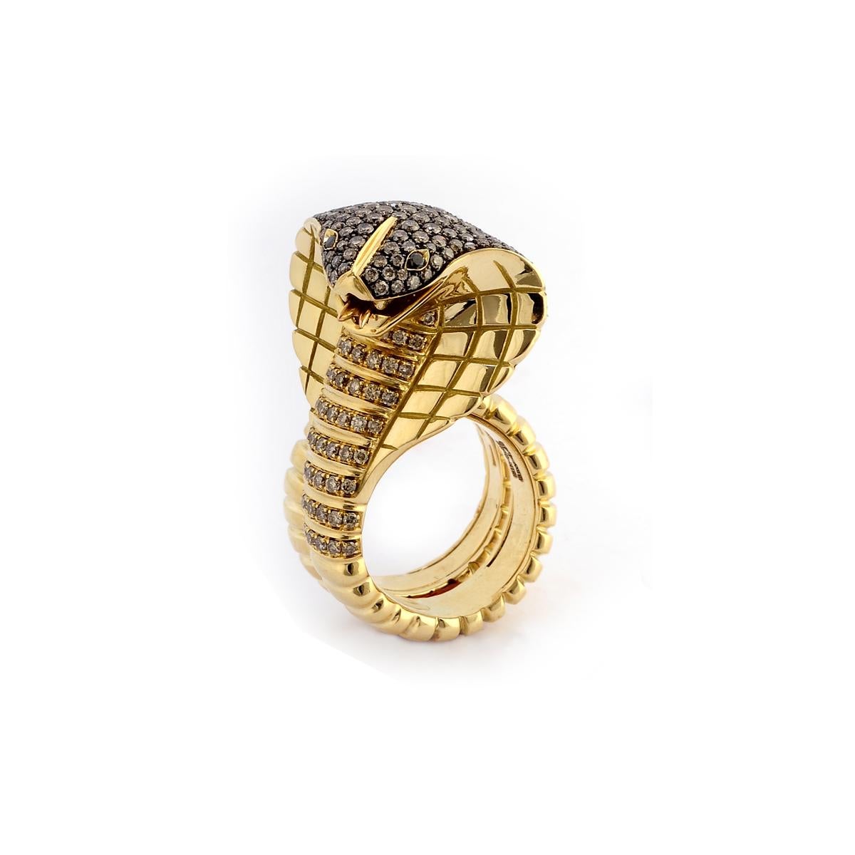 This bold fashion ring is only fit for women with a strong personality. Beautifully crafted in 18 Kt yellow gold, this wrap ring is shaped in a cobra design with a chocolate diamond-pavé head and multiple diamond accents. Two rubies make its eyes