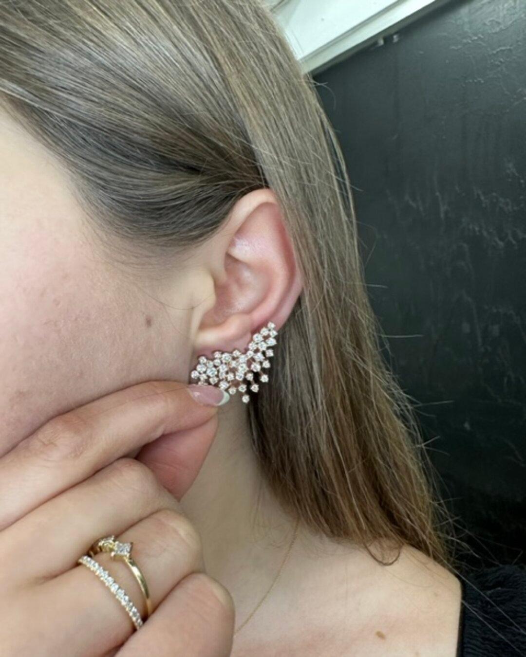 Crafted with care and precision, these beautiful Diamond Cluster Earrings are made with the highest quality of Gold that is built to last, and the Diamonds sparkle and shine in the light, adding a touch of glamour to any outfit. You can trust that