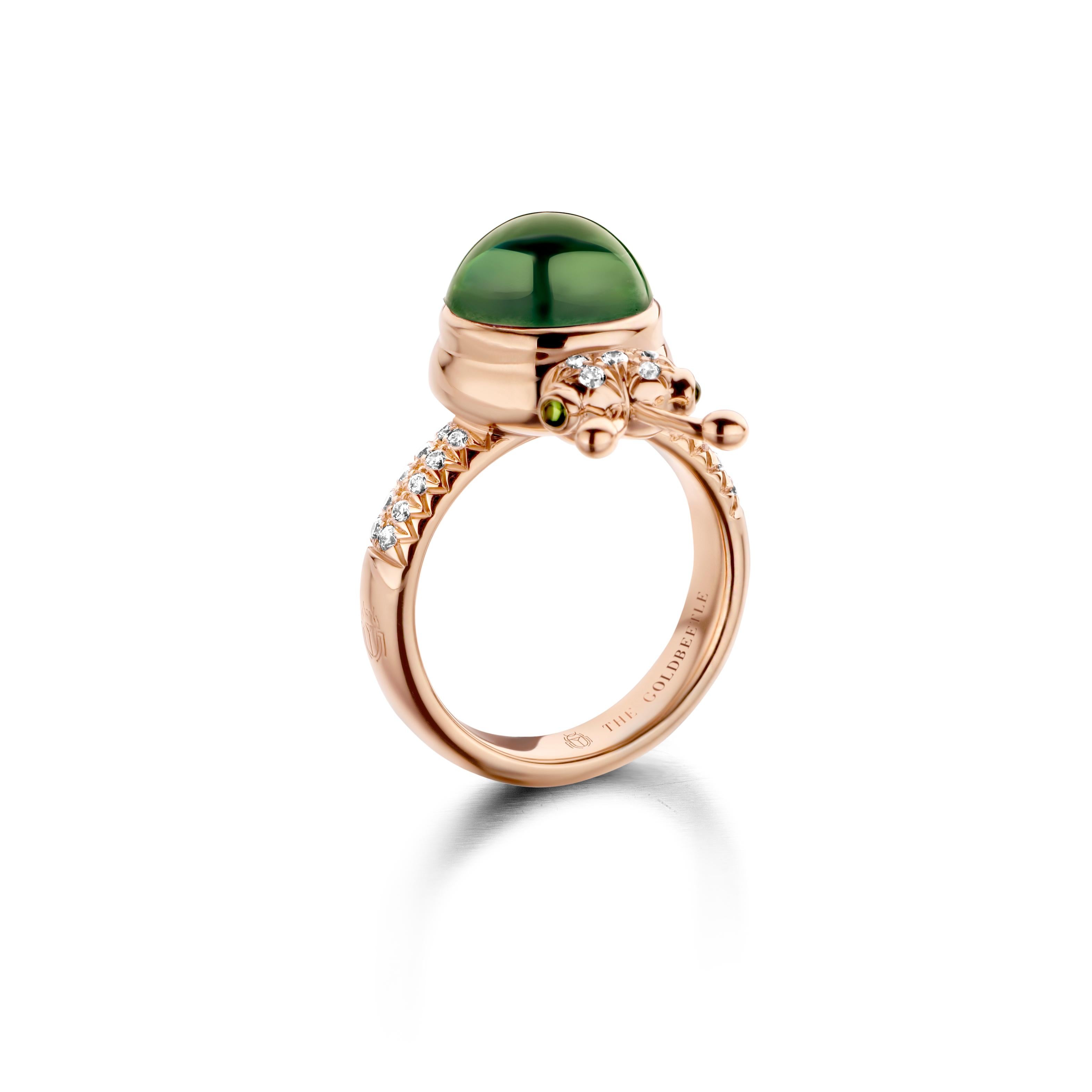 One of a kind lucky beetle ring in 18K rose gold 10g set with the finest diamonds in brilliant cut 0,23Ct (VVS/DEF quality) one natural, green tourmaline in round cabouchon cut 4,20Ct and two pink tourmalines in round cabouchon cut. 

Celine