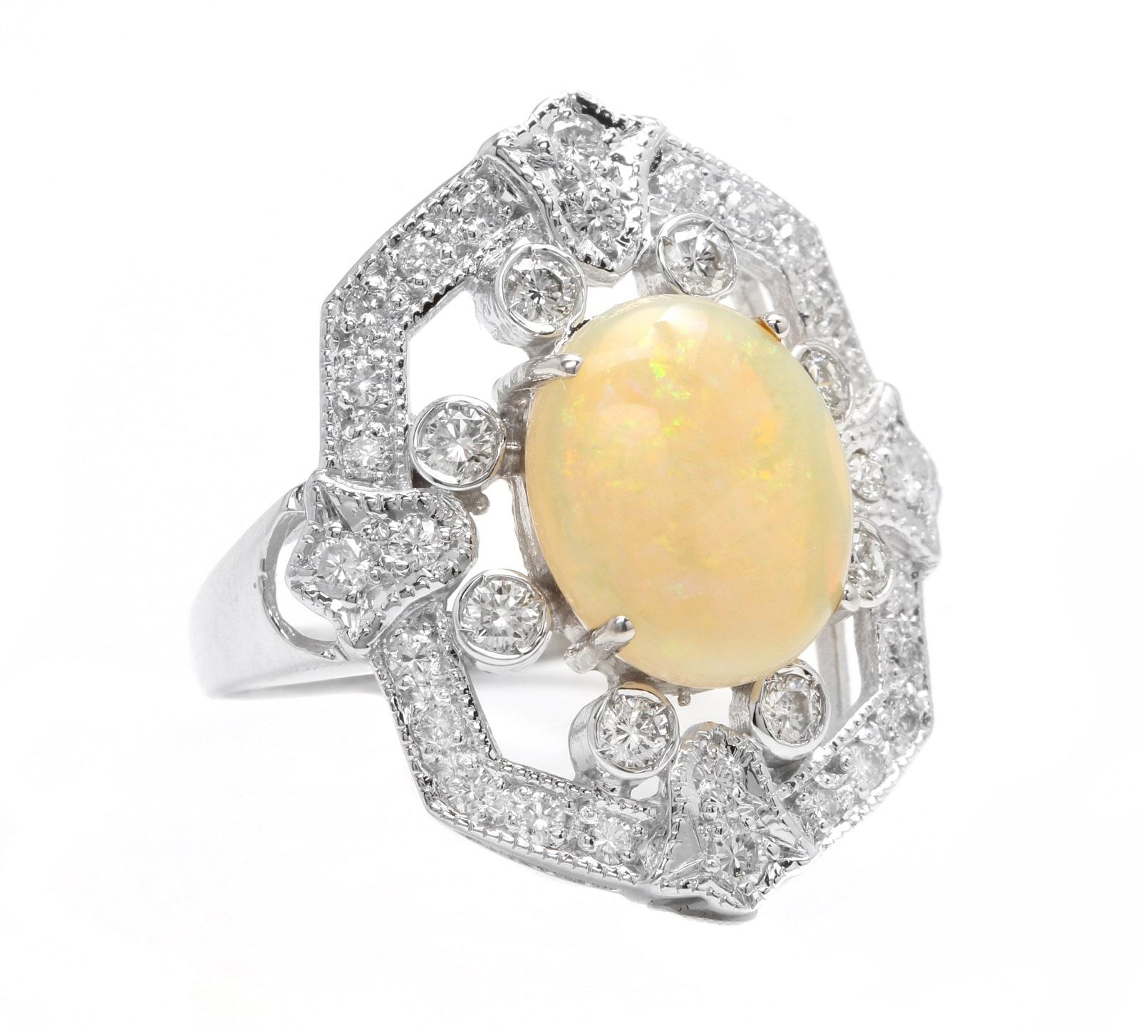 4.20 Carats Natural  Impressive Australian Opal and Diamond 14K Solid White Gold Ring

Suggested Replacement Value: $6,300.00

Total Natural Opal Weight is: Approx. 3.00 Carats 

Opal Measures: Approx. 12.00 x 10.00mm

Total Natural Round Diamonds