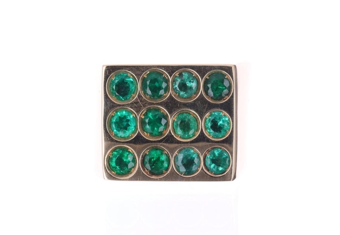 Setting Style: Signet
Setting Material: 18K Yellow Gold
Gold Weight: 18.9 grams

Main Stone: Emerald
Shape: Round Cut
Emerald Count: 12
Total Emerald Weight: 4.20-Carats
Clarity: Very Good
Luster: Very Good
Color: Green
Treatment: Natural,