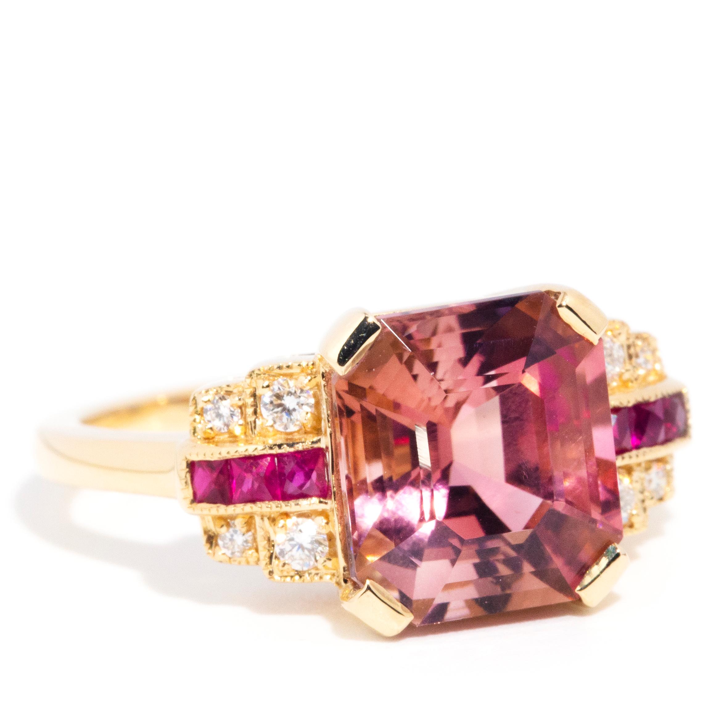 Forged in 18 carat yellow gold, this fanciful contemporary art deco-inspired features an opulent 4.21 carat Asscher cut bright pink tourmaline seated between raised shoulders each embellished with four sparkling round brilliant diamonds and embedded