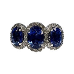 4.21 Carat Sapphire Three Stone Halo Ring 4.21 Carat Sapphire Three Stone Halo Ring