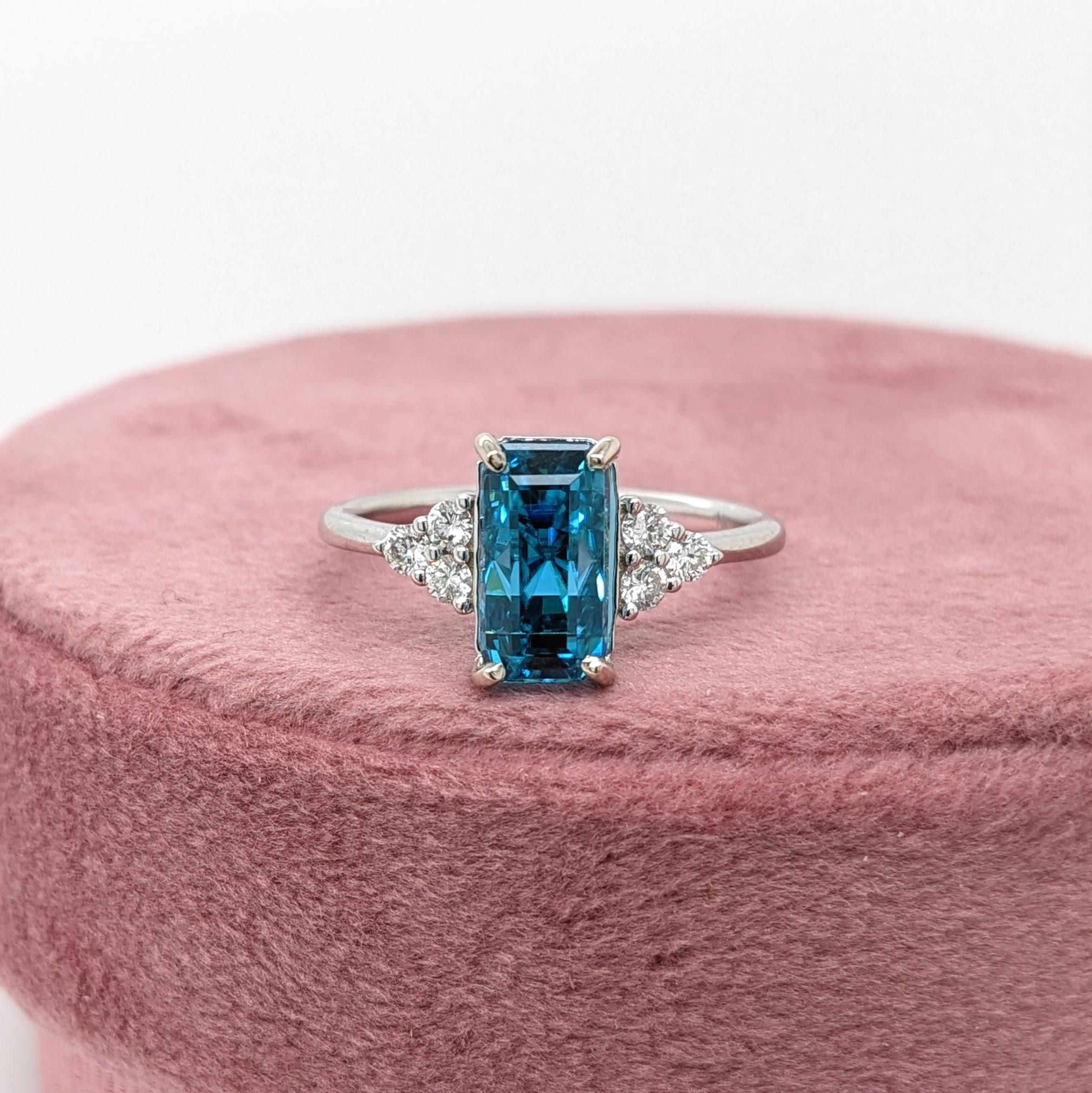 This statement ring features a gorgeous sparkling natural blue zircon in 14K solid white gold with a trio of diamond accents on either side making a cute minimalist design. A gorgeous ring for a modern bride, a December baby, or a lover of things