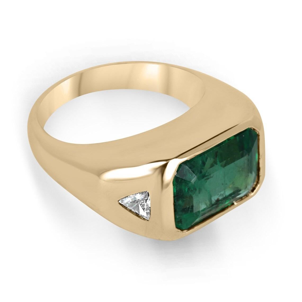 This elegant three-stone ring features a stunning dark green emerald cut emerald as its centerpiece, set east to west in a 14k yellow gold bezel setting. The emerald is flanked by two trilliant cut diamonds, adding sparkle and contrast to the rich