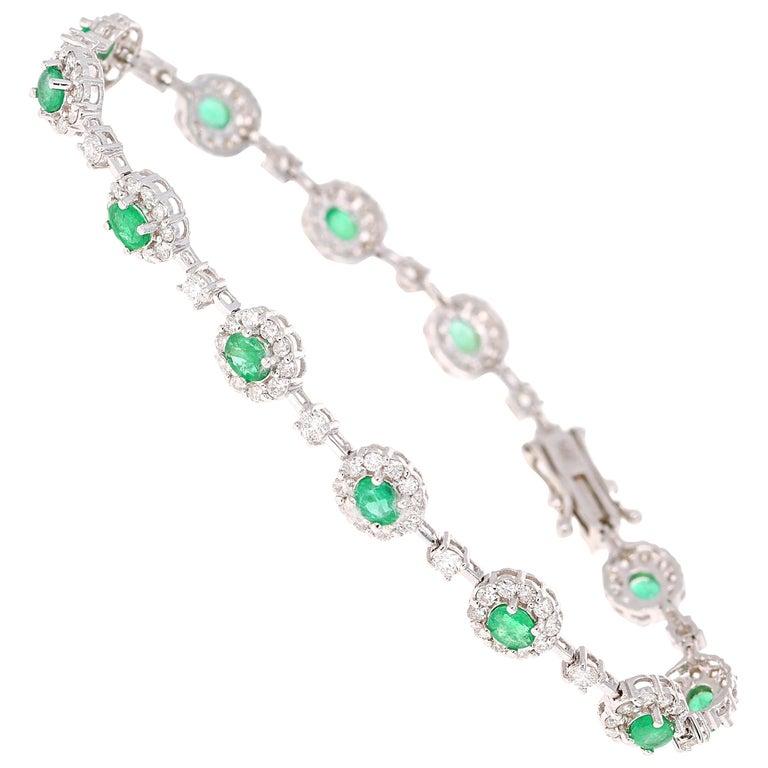 Dainty, Delicate, and Classically Beautful. 
A 14K White Gold Emerald and Diamond Bracelet. 

The 12 Oval Cut Emeralds that weigh 1.94 carats and the 135 Round Cut Diamonds that weigh 2.28 carats.  The Clarity and Color of the Diamonds is SI2/F. 