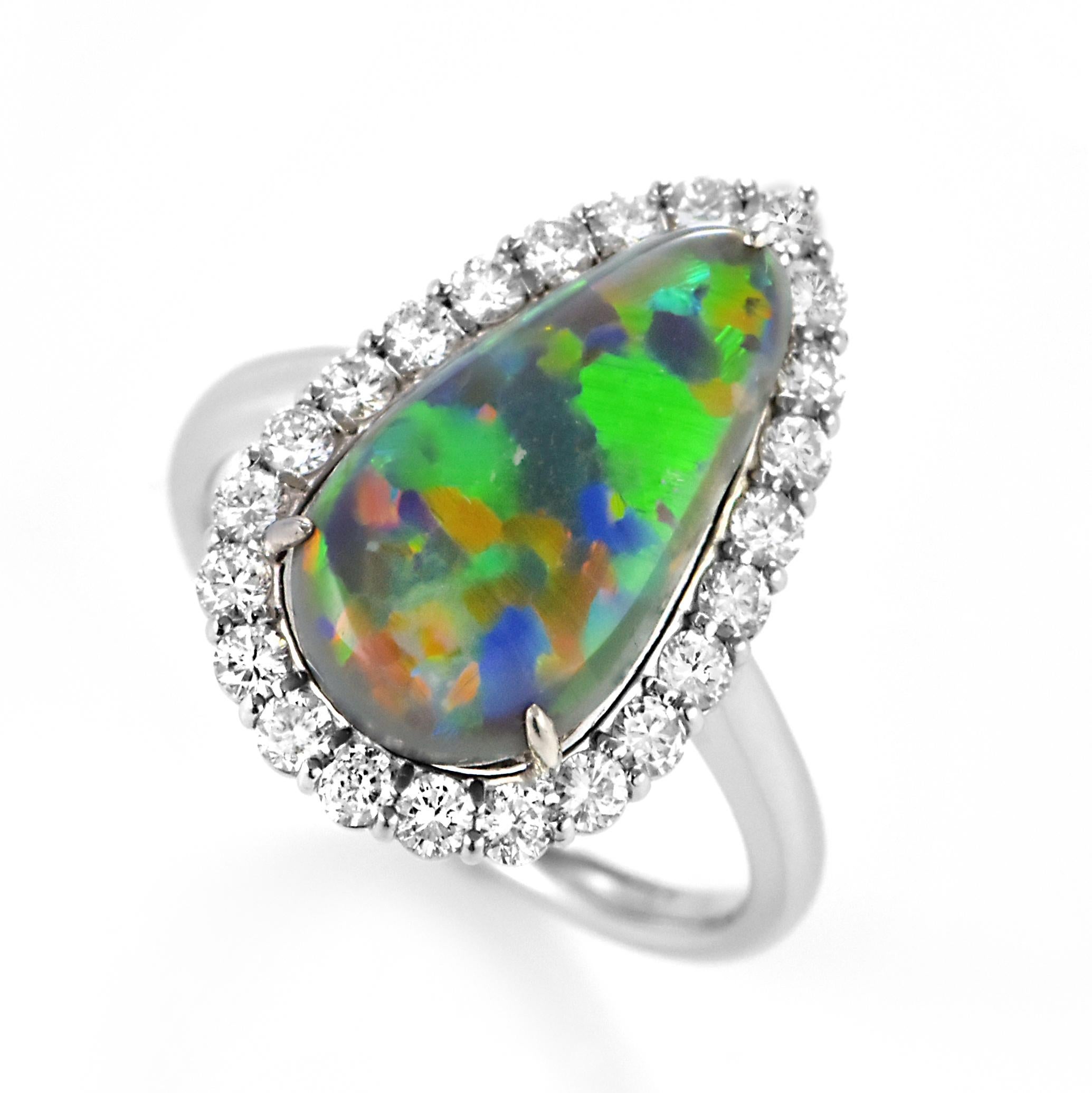 A beautiful ring featuring a 4.22 Carat Australian Black Opal and 0.66 Carat Diamonds made in Platinum. The Opal displays very good play of color! Opals are known for exhibiting flashes of rainbow colors known as 