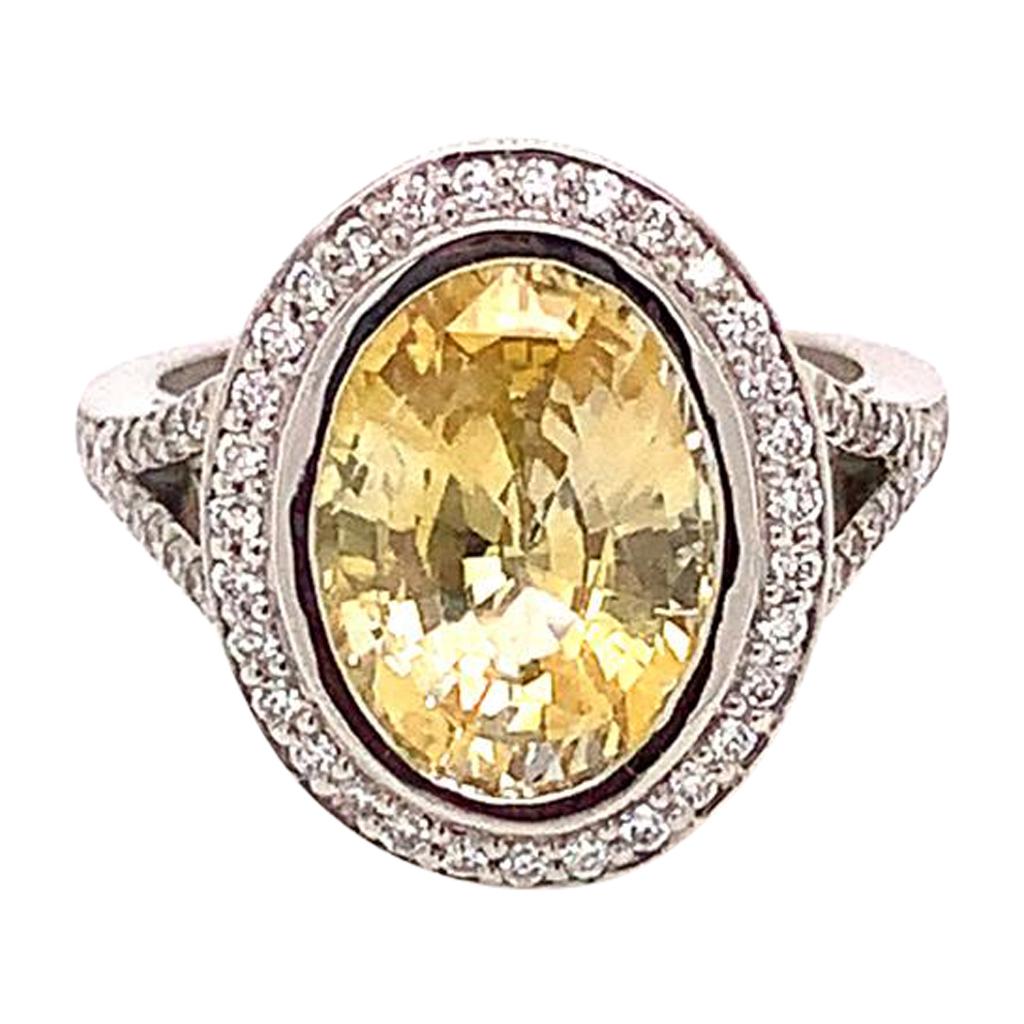 4.22 Carat Oval Brilliant Yellow Sapphire and Diamond Ring in Platinum For Sale