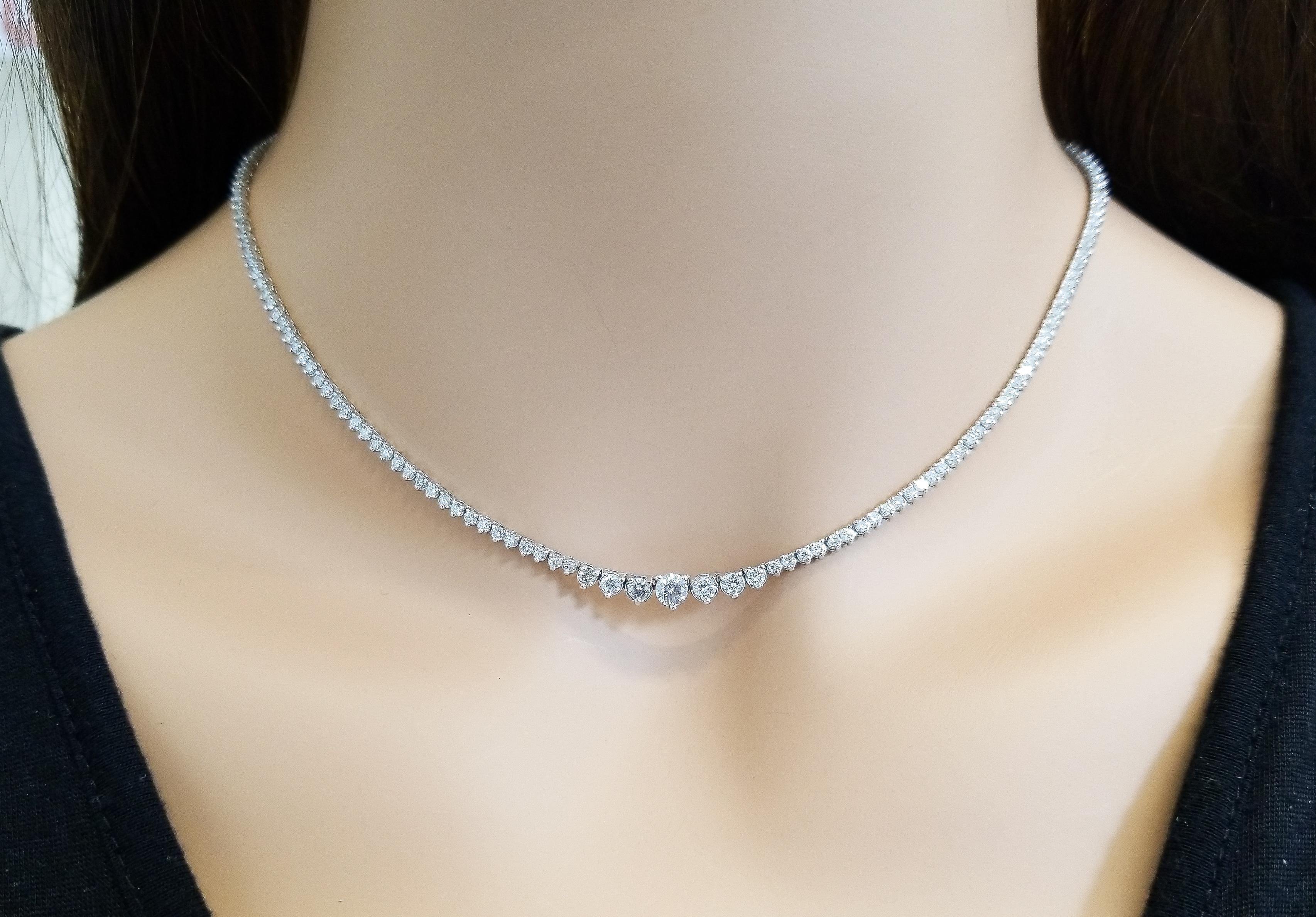 This is a graduated diamond riviera necklace. 191 round brilliant cut diamonds totaling 4.22 carats are precision set in the 3 prong classic setting. The diamonds complete around this outstanding piece in 14k white gold. With your hair up, you have