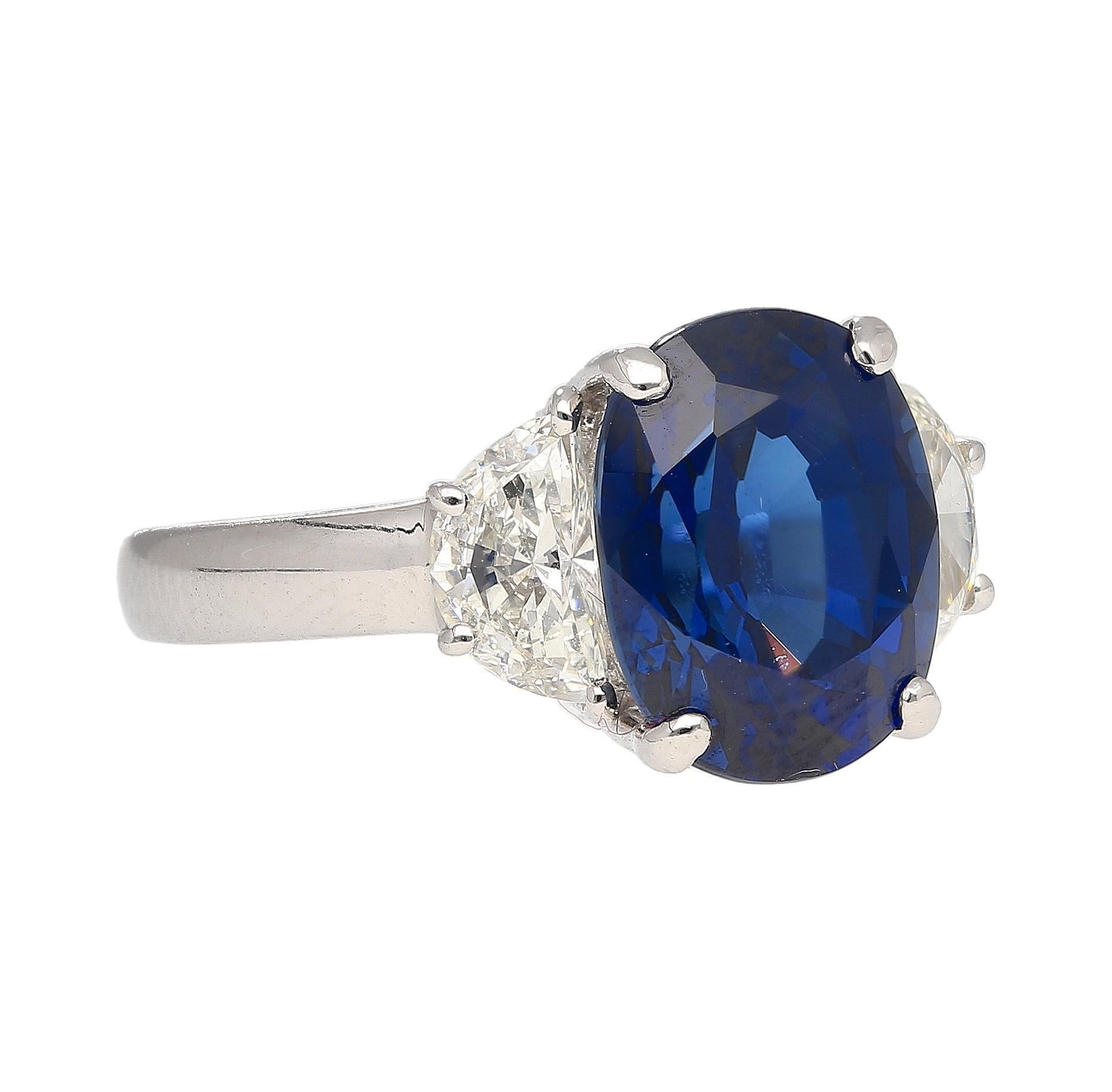GRS Certified 4.22 Carat Oval Cut Vivid Blue Natural Sapphire with 2 Half Moon Cut Diamonds in 18k White Gold Three Stone Ring.

Details: 
 Item Type: Three Stone Ring
 Metal: 18K White Gold
 Size: 6 (adjustable)
 Weight: 3.90 Grams
 
Center Stone
