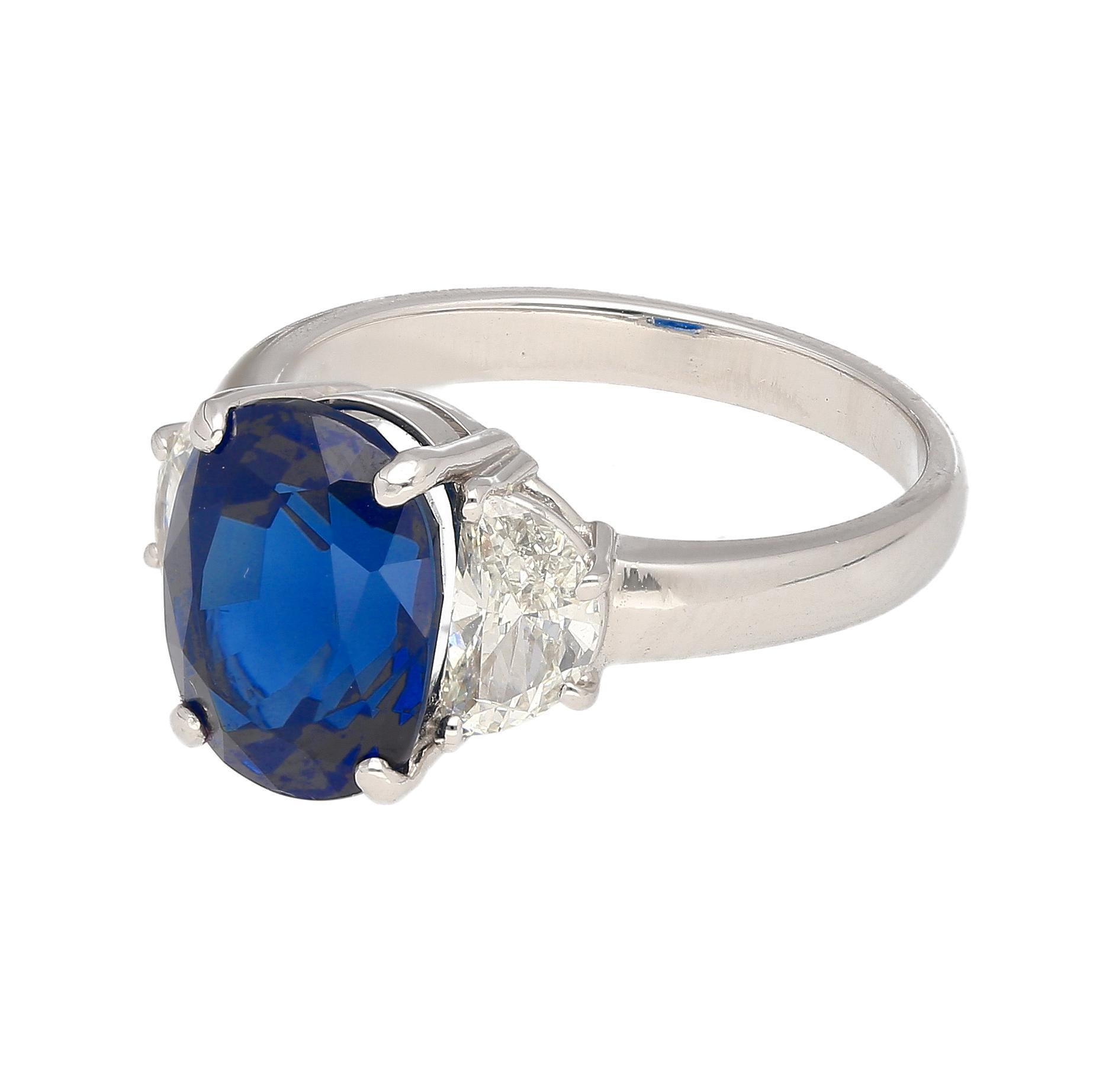 Women's 4.22 Carat Vivid Blue Oval Cut Sapphire & Diamond 3 Stone Ring For Sale