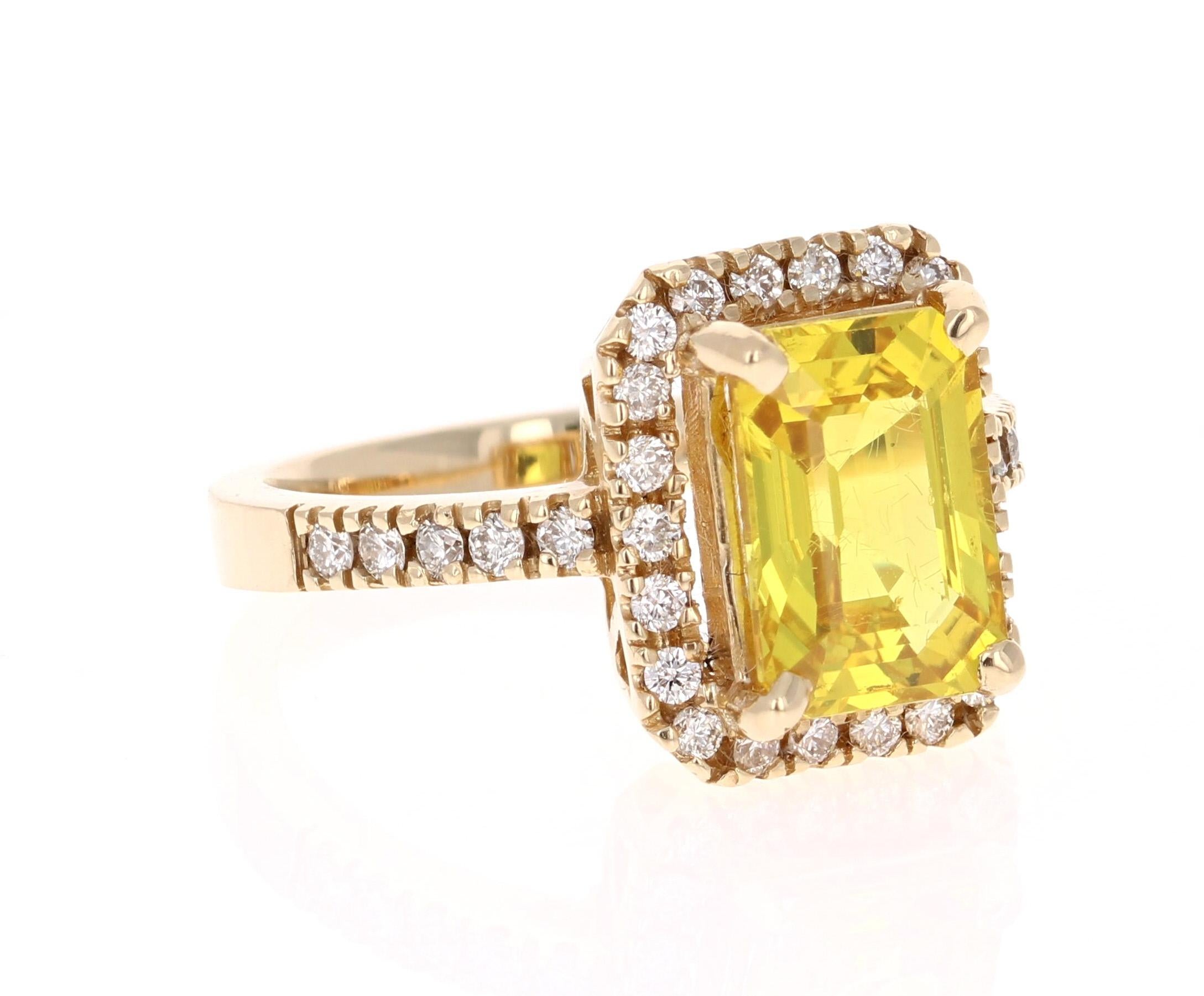 Gorgeous Yellow Sapphire and Diamond Ring that can be a Cocktail ring or a stunning Engagement ring!
This ring has a 3.73 Carat Emerald Cut Yellow Sapphire in the center of the ring and is surrounded by 32 Round Cut Diamonds that weigh 0.49 carats.