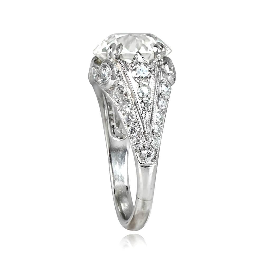 This is a stunning geometric platinum engagement ring with a 4.22 carat old European cut diamond, K color and VS2 clarity, prong-set. Four bezel-set old European cut diamonds frame the center stone. Rows of old European cut diamonds adorn the