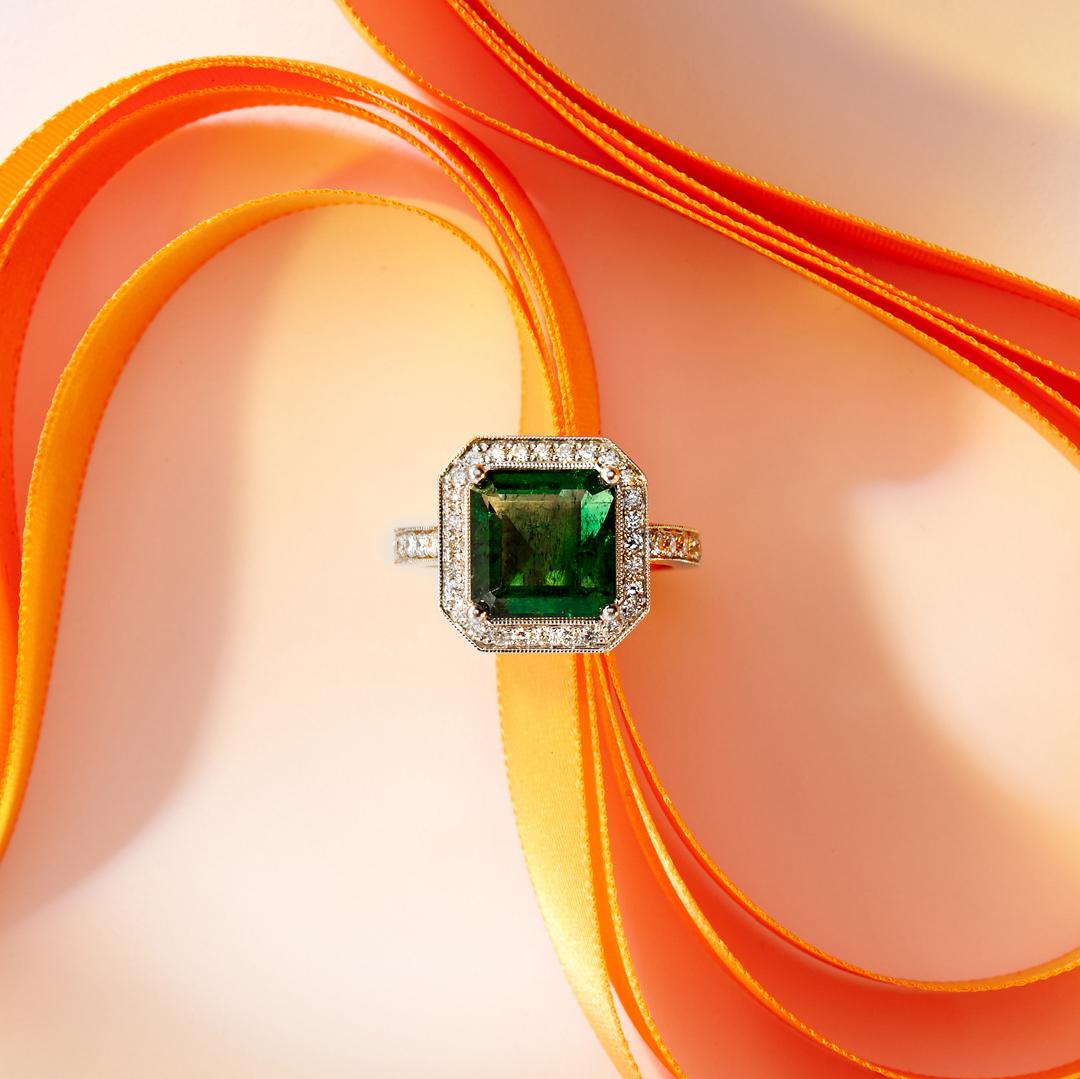 Our Emerald and Diamond Ring features a natural 4.23ct Emerald handpicked by Matthew Ely and is highlighted with magnificent 40 Bright White Diamonds (color G / H clarity SI) set in 18ct White and Yellow gold.  Resizing available free of charge
