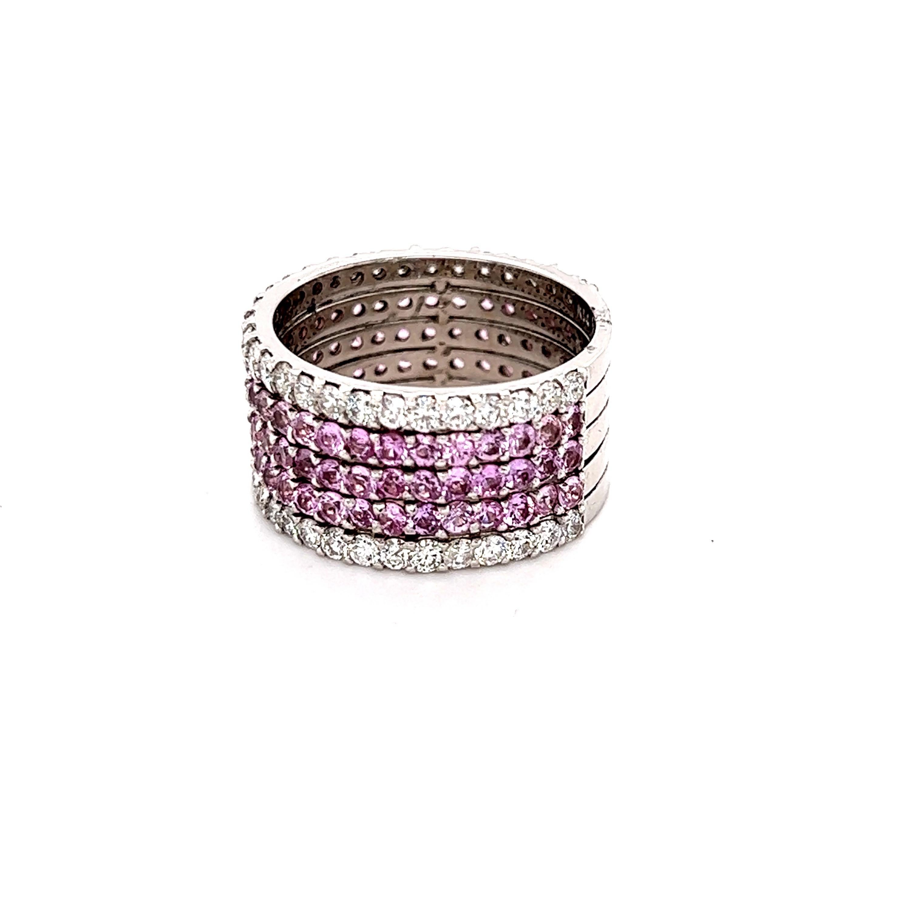 This ring has 90 Natural Round Cut Light Pink Sapphires that weigh 2.72 Carats as well as 60 Round Cut Diamonds that weigh 1.51 Carats. The total carat weight of this ring is 4.23 carats. 

Crafted in 14 Karat White Gold and weighs approximately 7.2