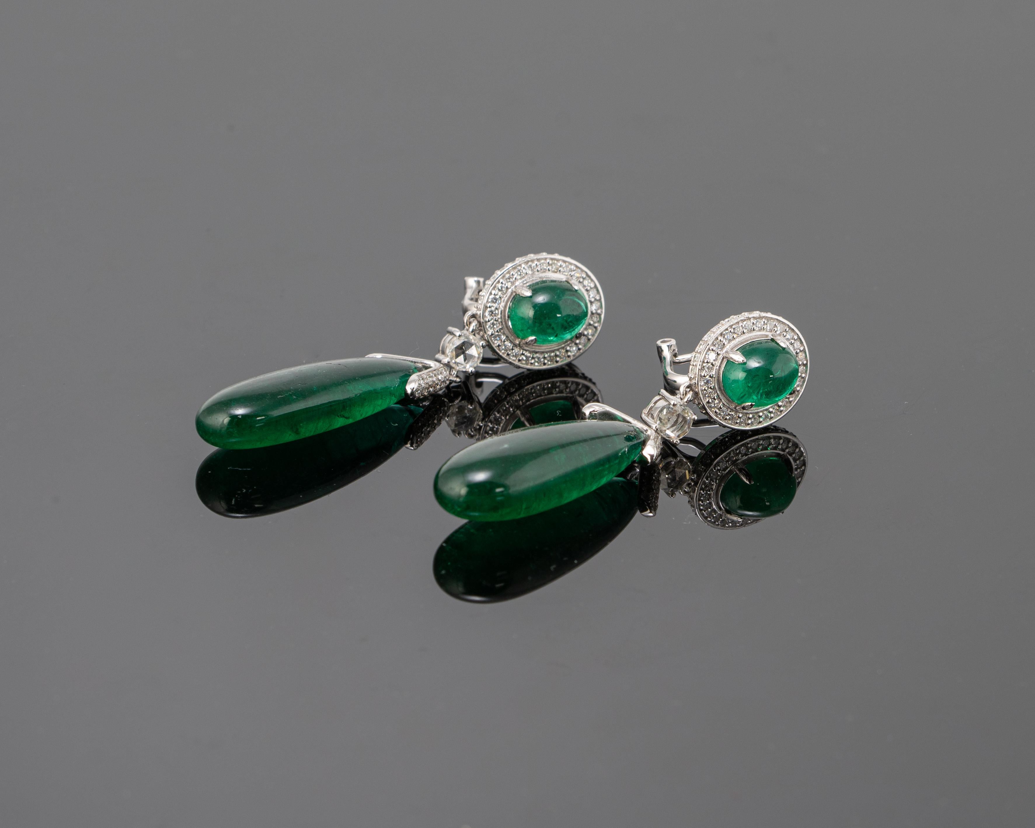 A stunning pair of 37.41 carats Emerald drop earrings and 4.91 carats Emerald cabochons, set with Diamonds in 18K White Gold. The earrings have an omega backing for extra support. Please feel free to message us if you have any queries. 
Free