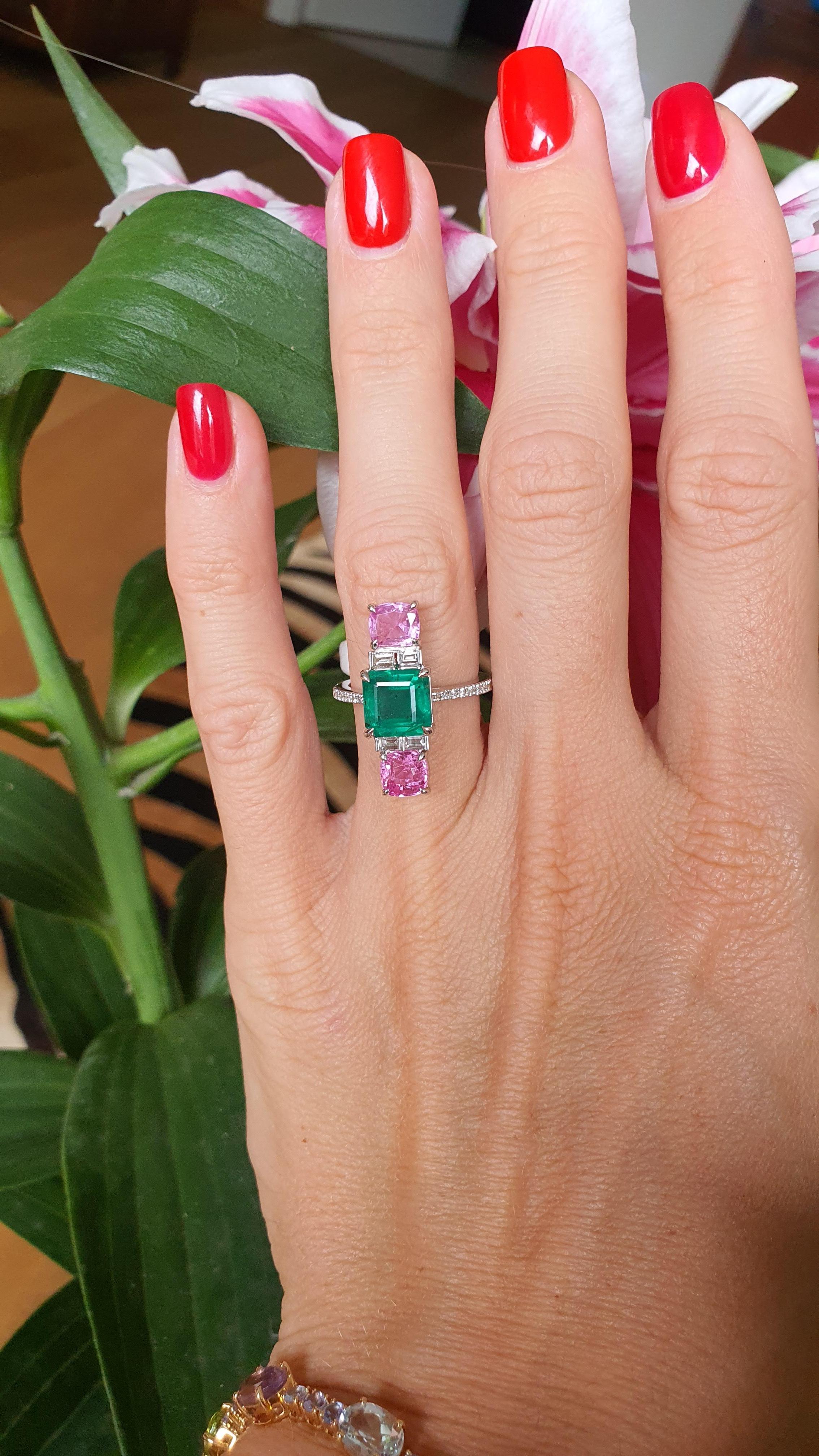 
Stunning multigem ring featuring two cushion cut gorgeous pink Sapphires , impressive 2.09 Ct Emerald on a timeless combination of 18 K White gold with round diamonds. The undeniable beauty of this jewelry is performed in classy and in the same