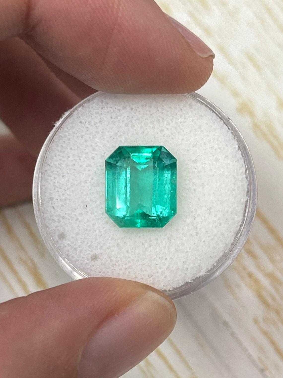 Stone: Emerald
Weight: 4.24-carats
Shape: Emerald Cut
Clarity: Transparent
Luster: Very Good
Color: Bluish Green
Measurements: 10.69mm x 9.23mm x 6.06mm
Geographic Origin: Colombia
Treatment: Natural, Oiling

Comments: Due to their growth conditions