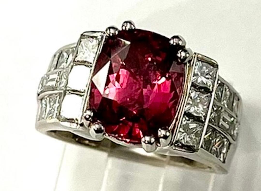 The Sapphire in this ring has a very unique and rare Reddish Peach  color. The hue is rich, deep, saturated and the distribution of color is even. This Sapphire is is very clean and has a very vibrant transparency.  The ring also has Natural White