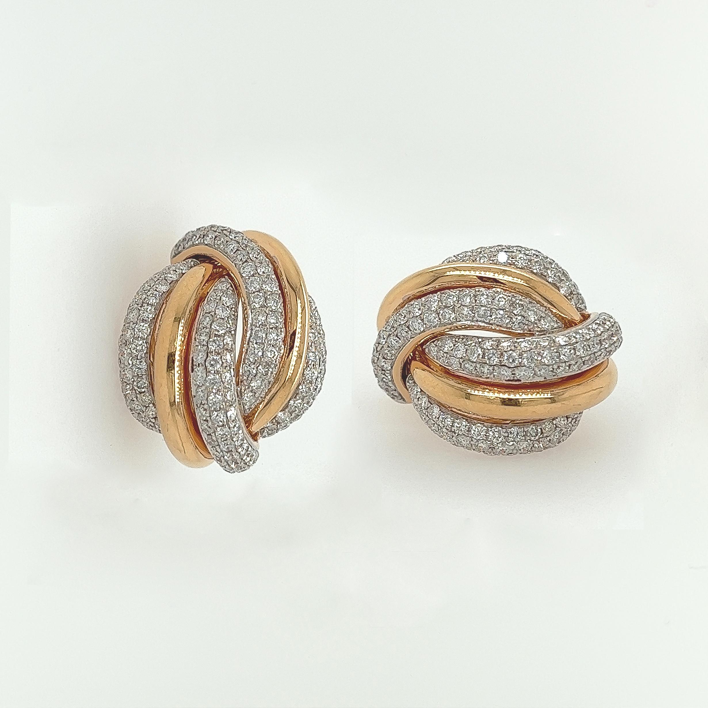4.25 Carat Diamond and Gold Earrings in 18K Rose Gold

Classy gold hoop earrings exquisitely designed and built. The twist of diamond and rose gold makes the earrings stand out. A great versatile addition to your wardrobe that goes with many things.