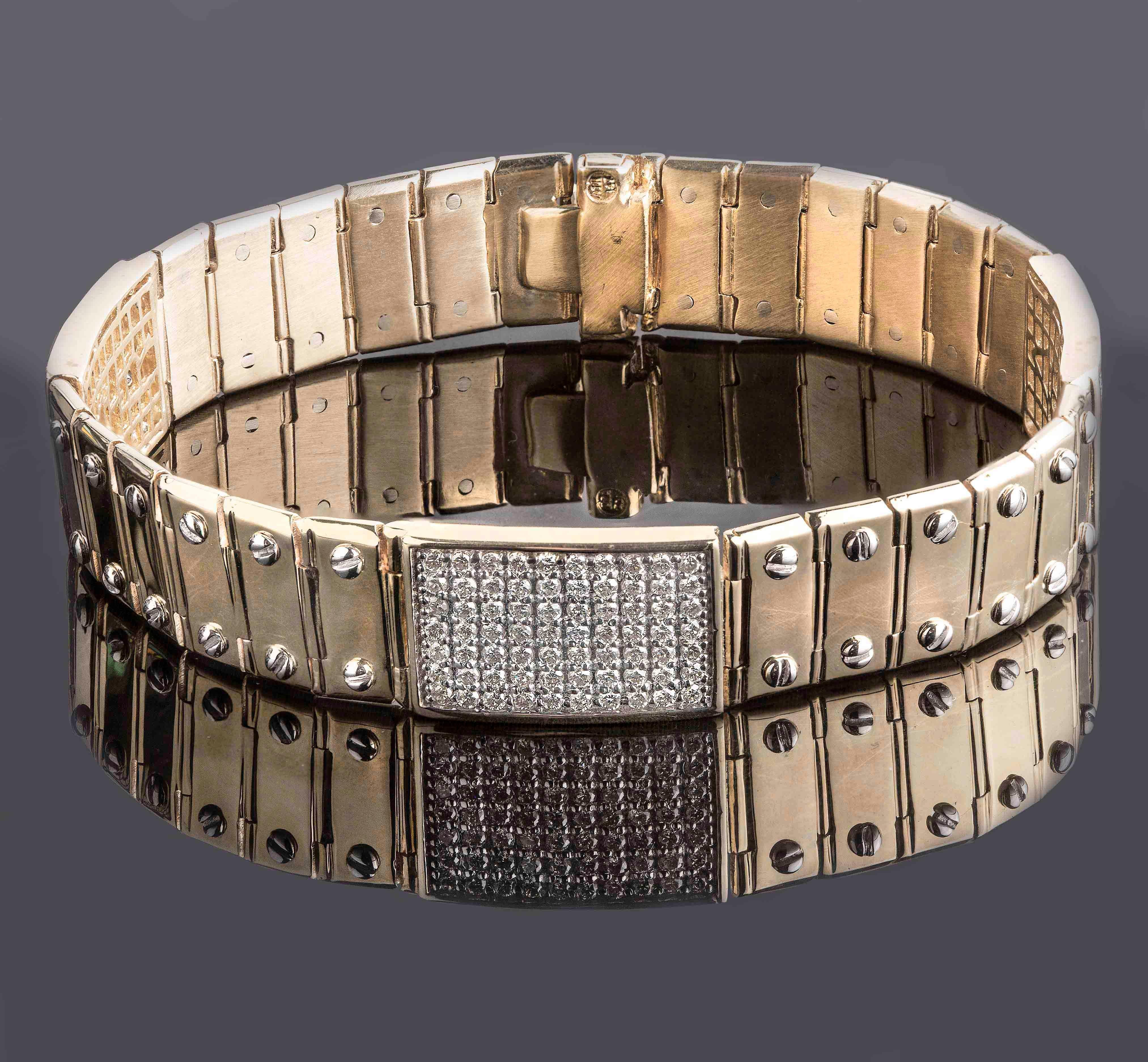 Handcrafted from solid 14K yellow gold, this stunning bracelet features four diamond-encrusted plates, each measuring 14 x 21mm, adorned with round-cut diamonds in F/G color and SI/I clarity, set in a brilliant pave setting. The plates showcase an