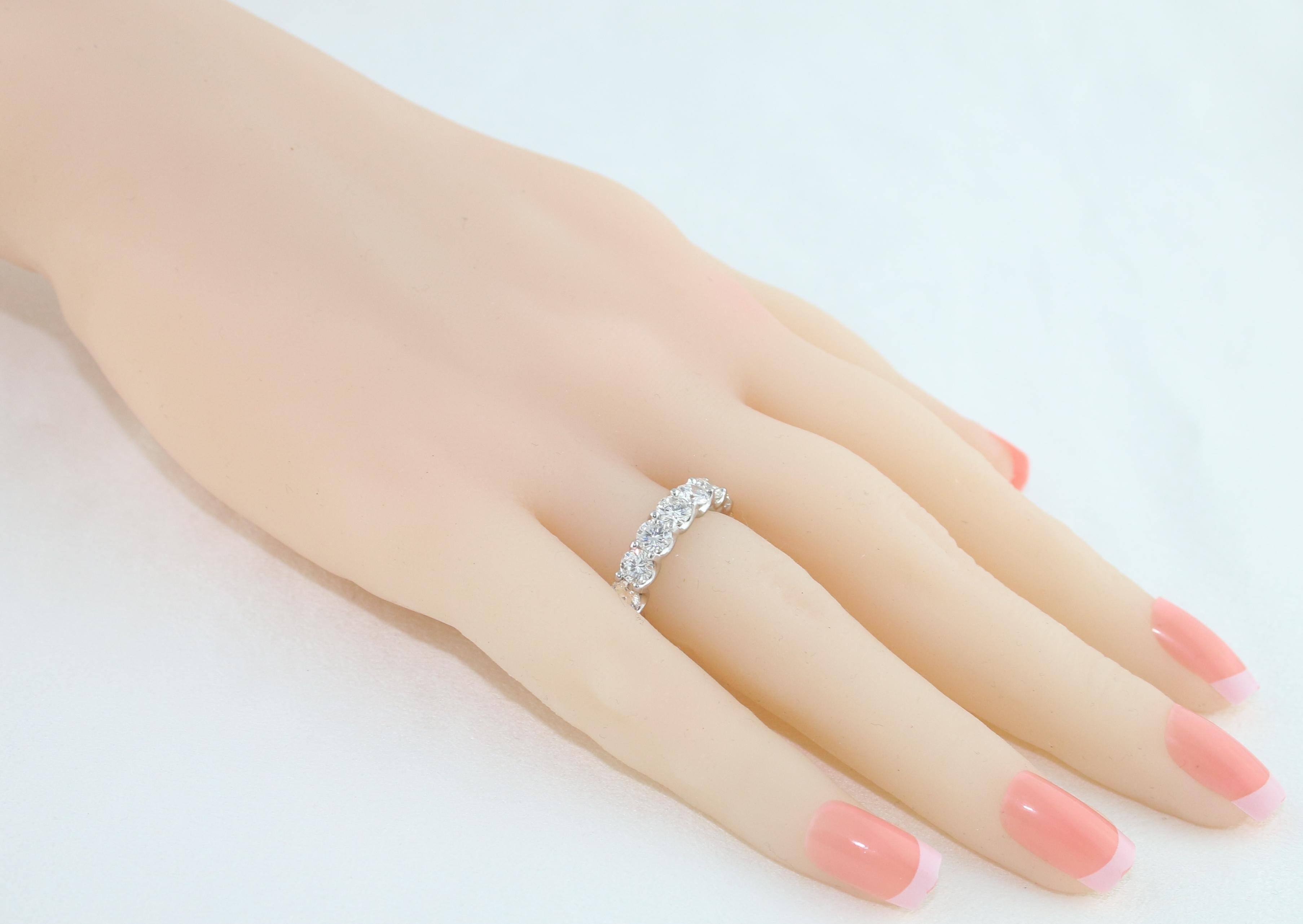 Modern 4.25 Carat Round Cut Diamond Platinum Eternity Band Ring For Sale
