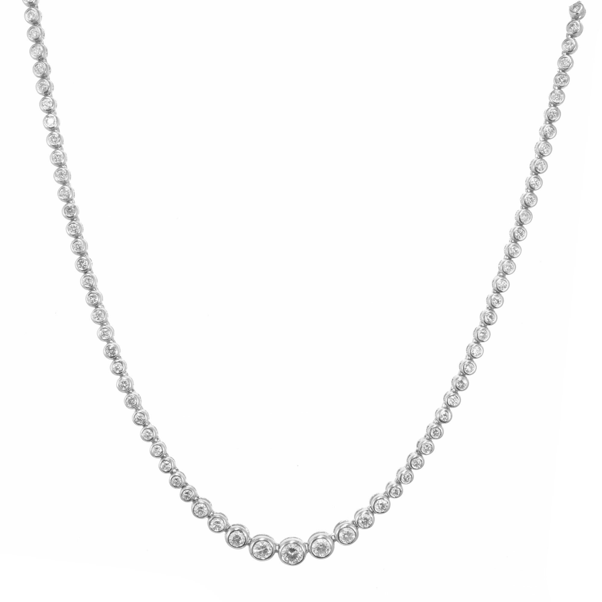 Magnificent graduated bezel set diamond tennis necklace. 103 round brilliant cut diamonds in 18k white gold bezels. 16 inches long with a built in safety.

103 round brilliant cut diamonds, H-I SI approx. 4.25cts
18k white gold 
Stamped: 18k
20.1