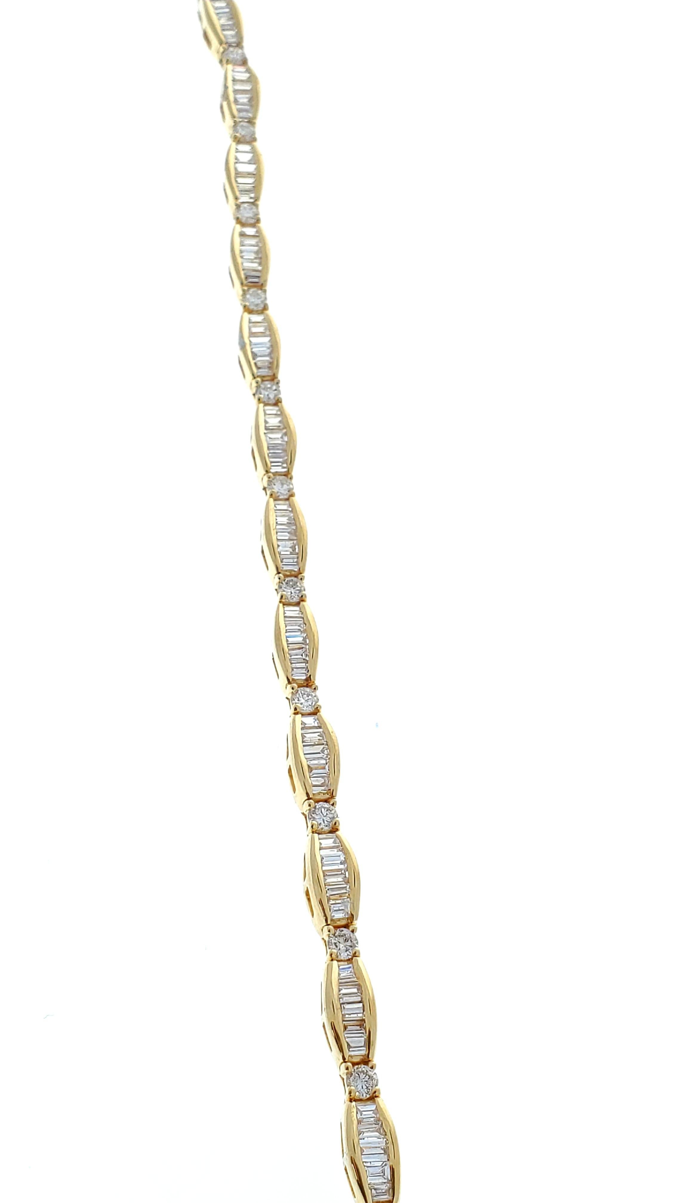 Custom made with luxury and prestige in mind, this stunning brightly polished 14 karat yellow gold tennis bracelet features all the glamour and brilliance that diamonds have to showcase in an unforgettable design. A total of 4.25 carats of baguette